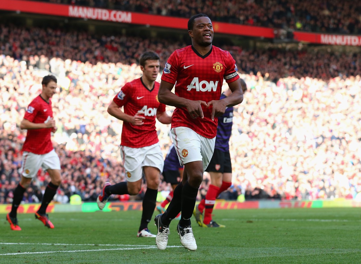 Patrice Evra celebrates scoring for Man Utd against Arsenal