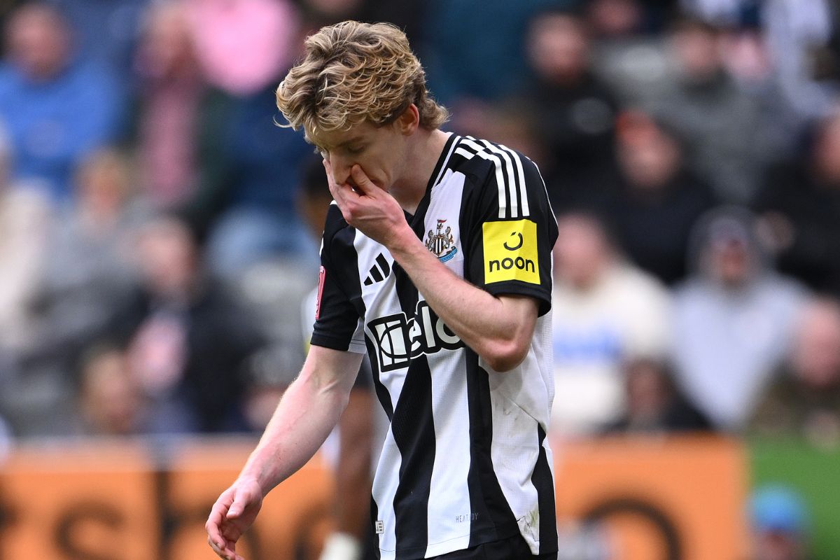 Anthony Gordons walks off clutching his nose after being red-carded.