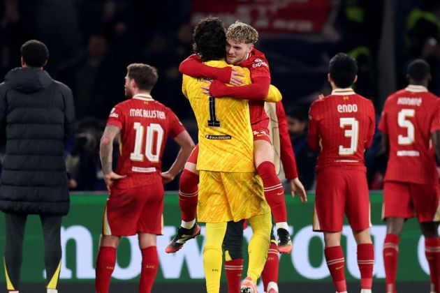 Harvey Eliott jumps into the arms of Alisson Becker