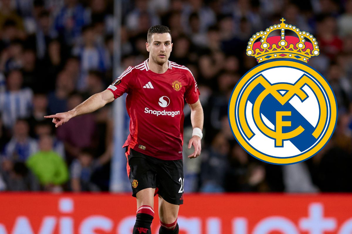 Diogo Dalot points to ground - while Real Madrid badge is attached