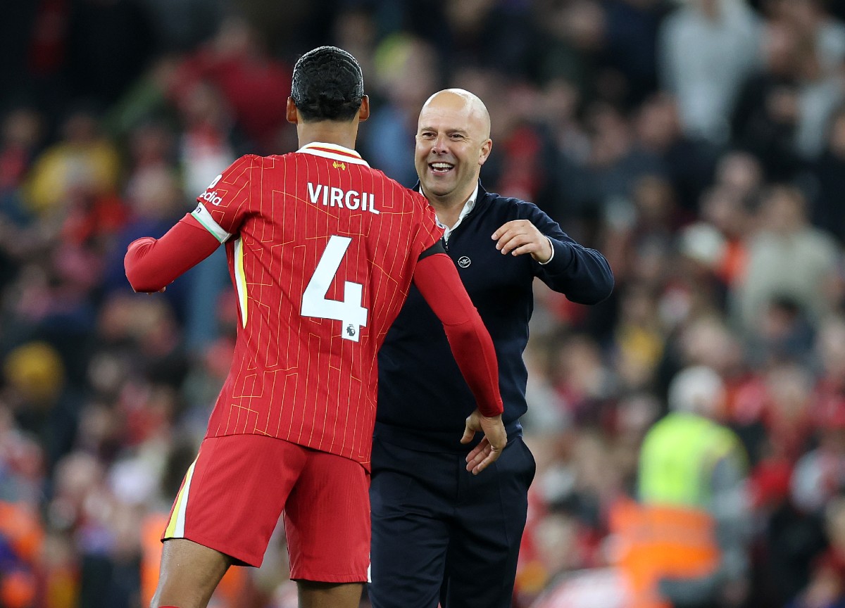 Virgil van Dijk hugging Liverpool manager Arne Slot