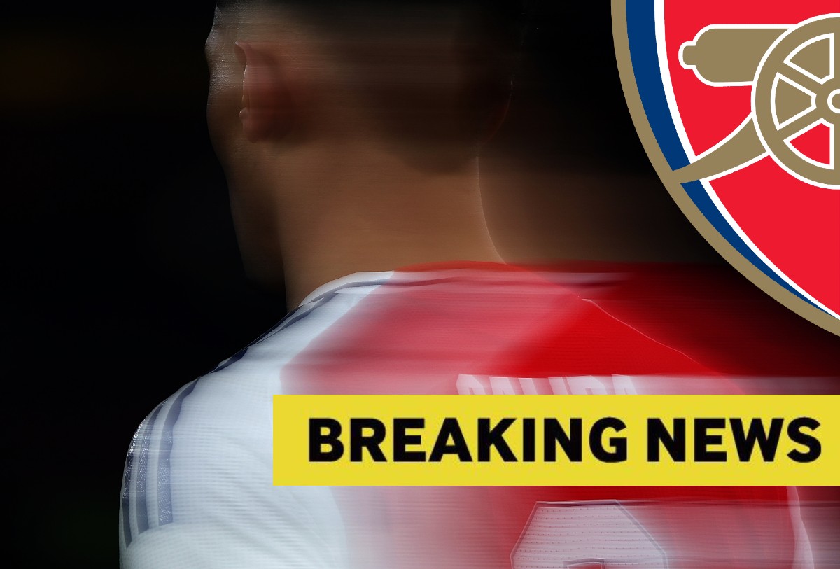 Blurry close up of William Saliba in action for Arsenal, plus yellow breaking news banner