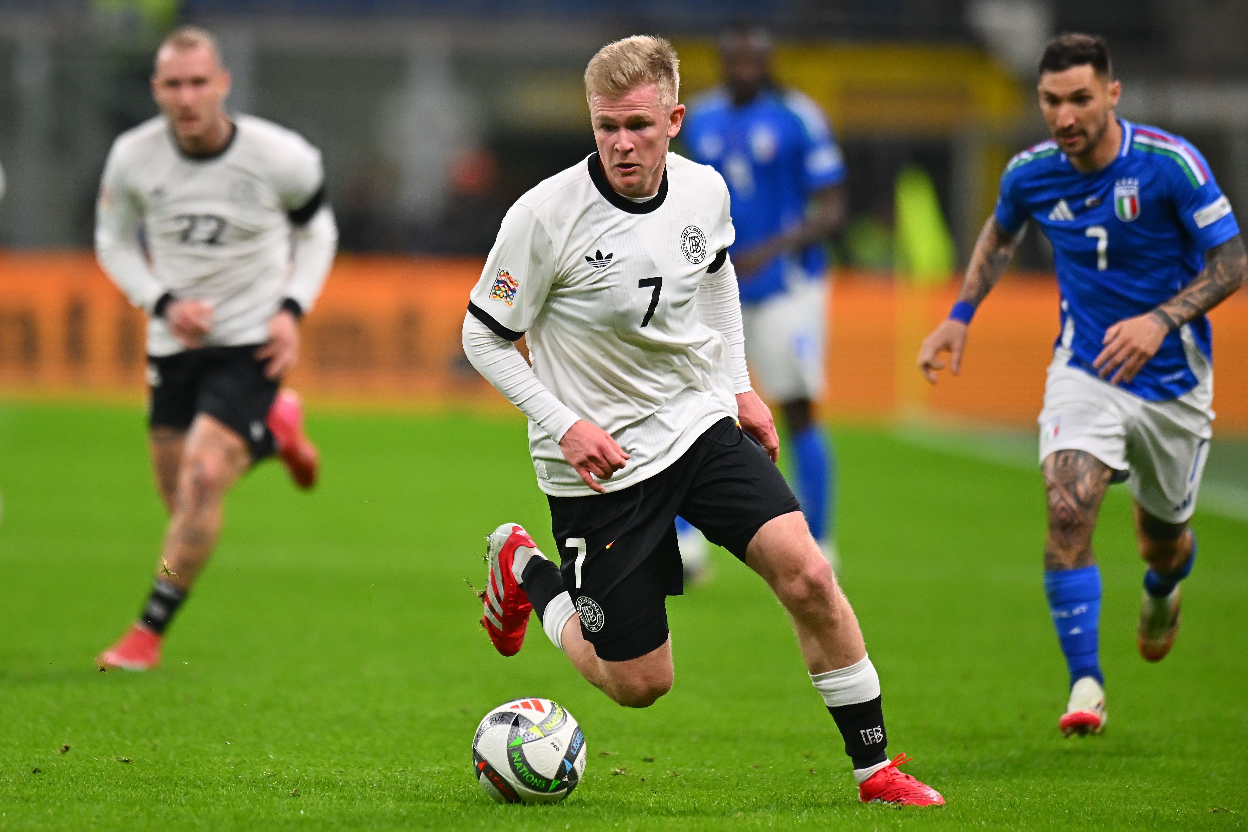 Jonathan Burkardt of Germany runs with the ball