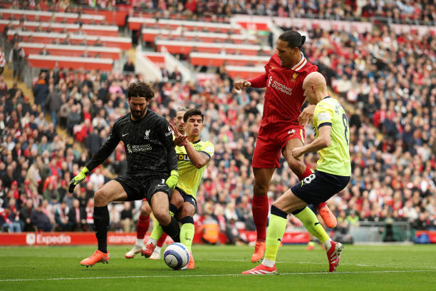 Smallbone before dialing vs Liverpool after mix between Alisson and Van Dijk