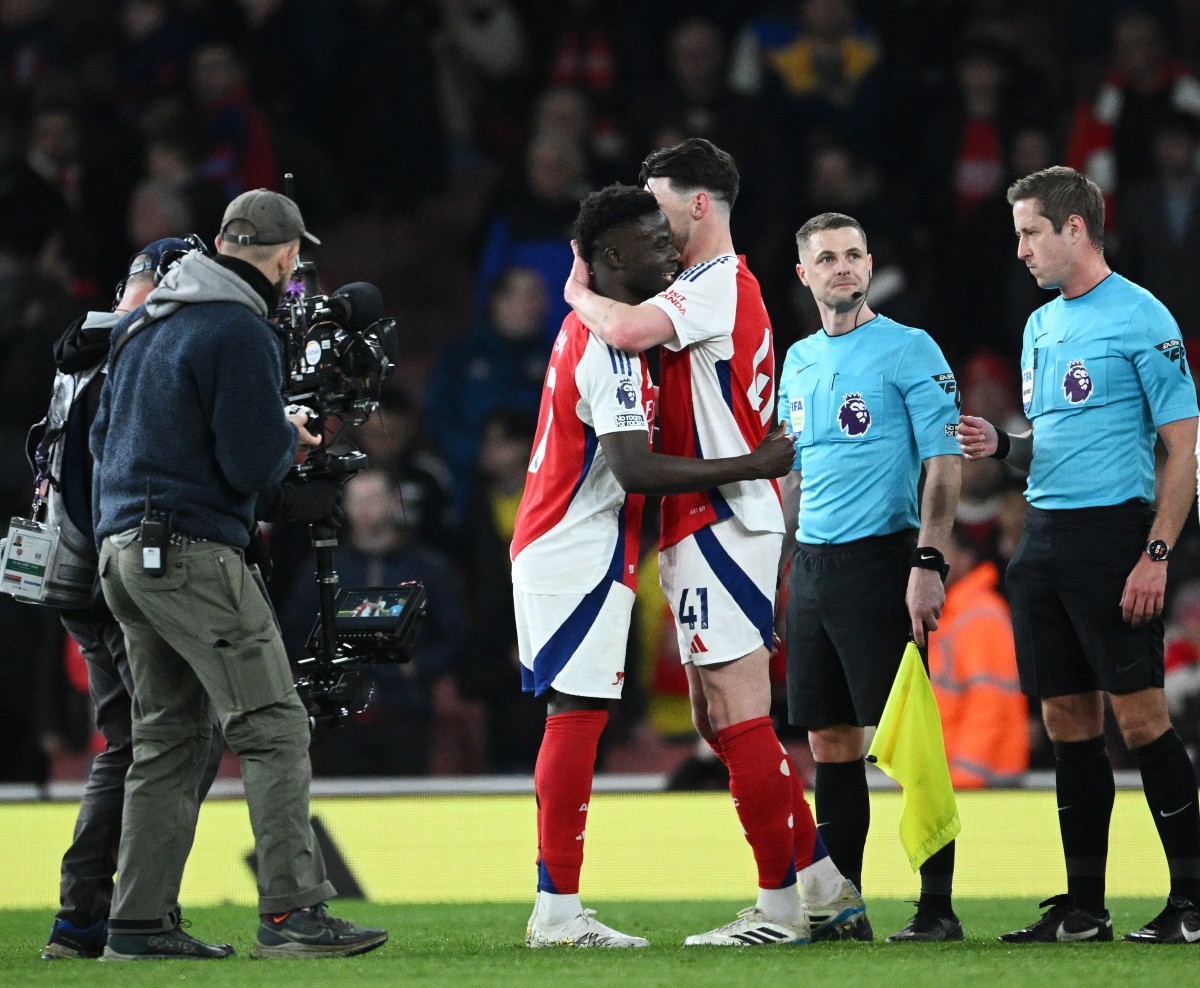 Bukayo Saka and Declan Rice hug after Arsenal's win over Fulham
