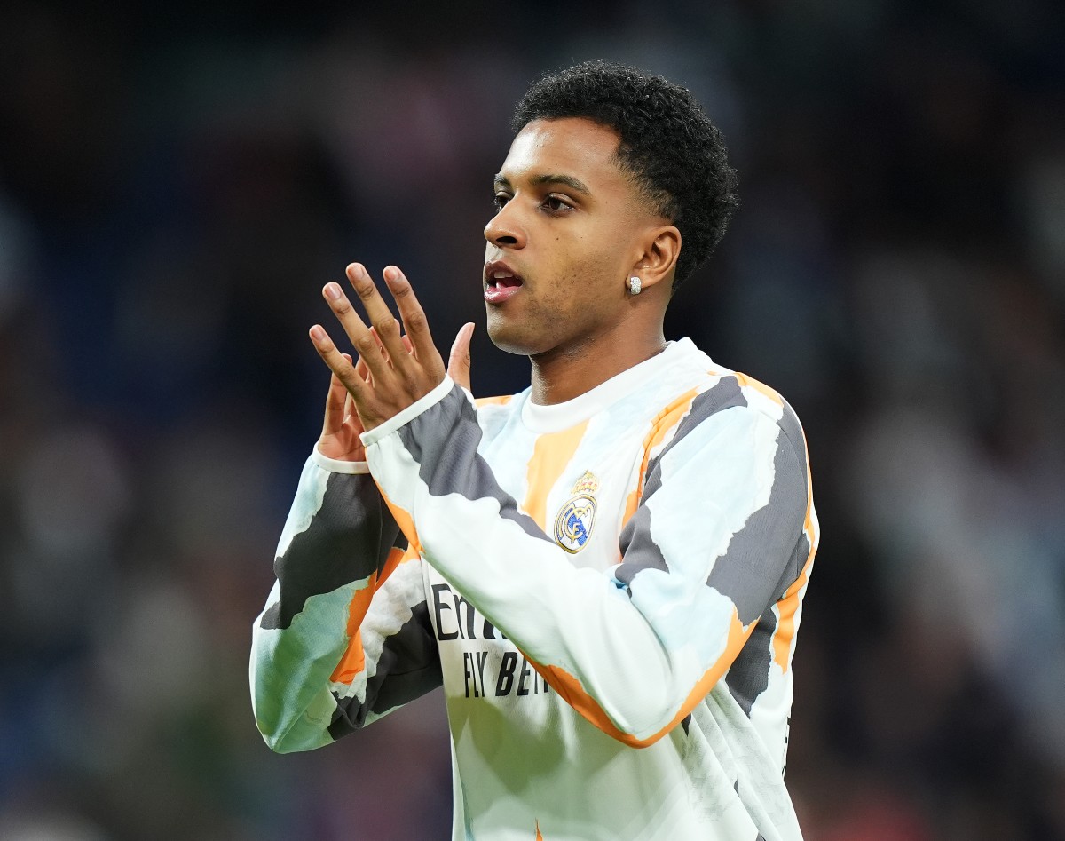 Rodrygo applauds the Real Madrid fans during his pre-match warmup