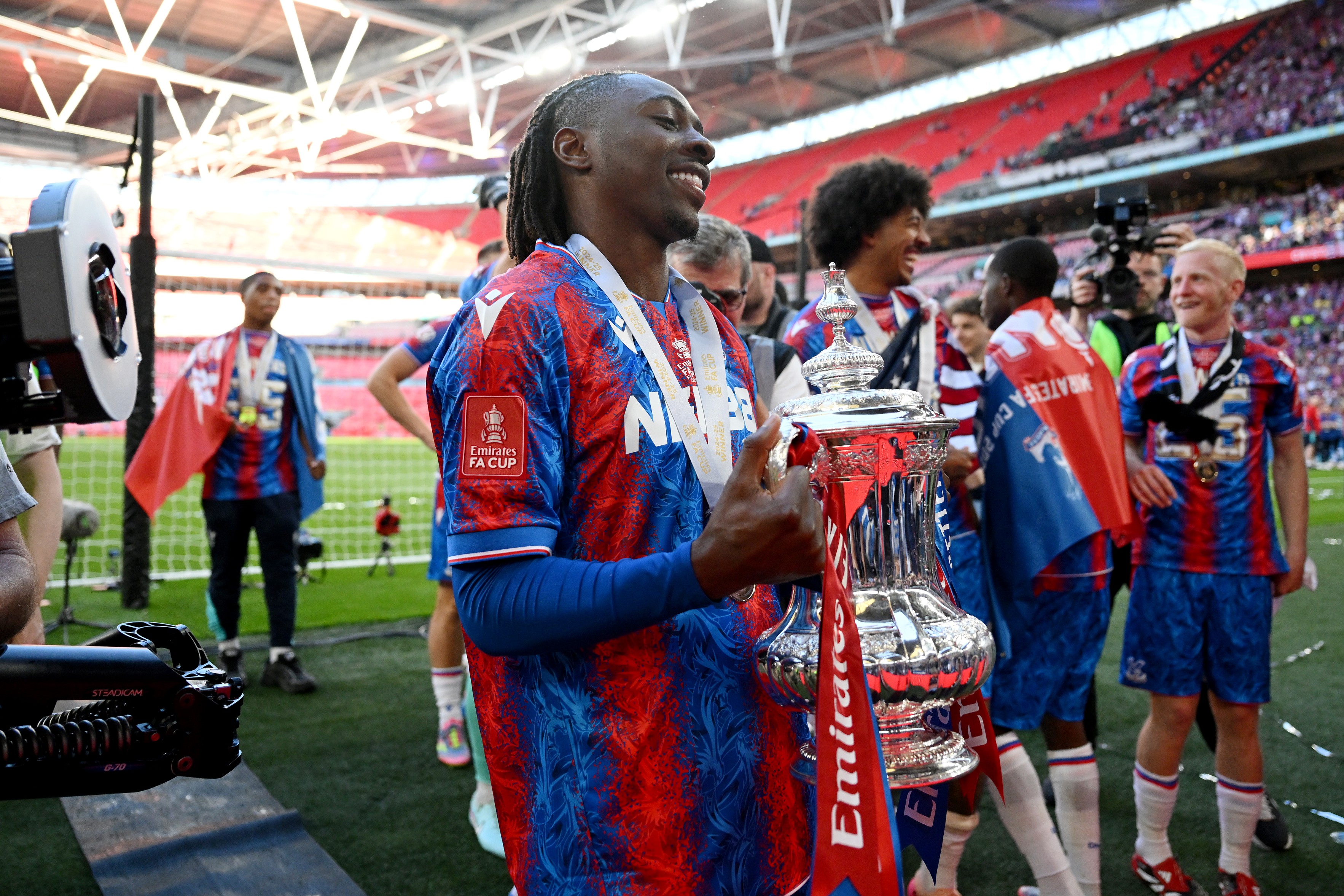Crystal Palace's Ezechi Eze Pulls a picture with the FA Cup Cup