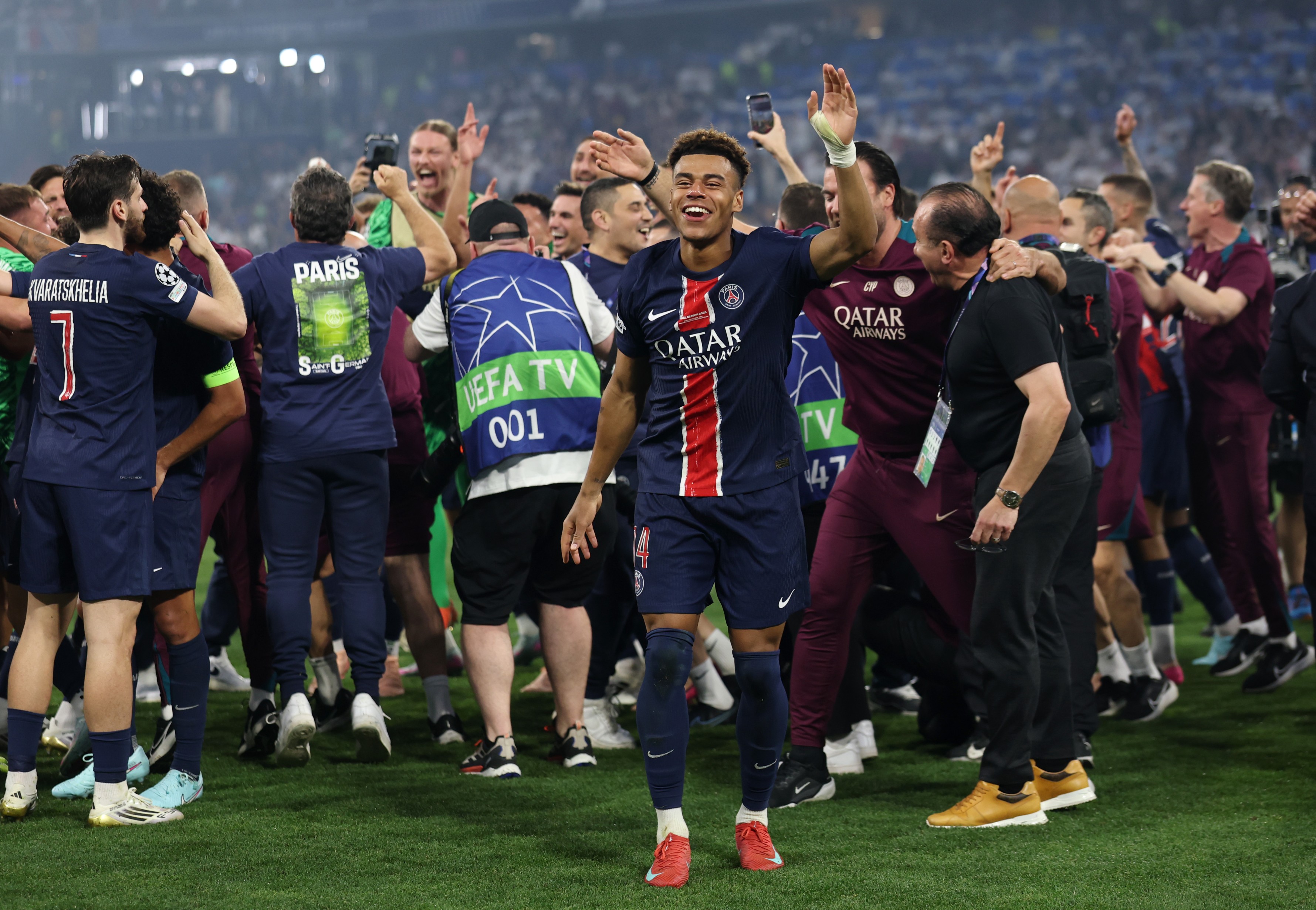 Desire Doue of Paris Saint-Germain acknowledges the fans as he celebrates victory