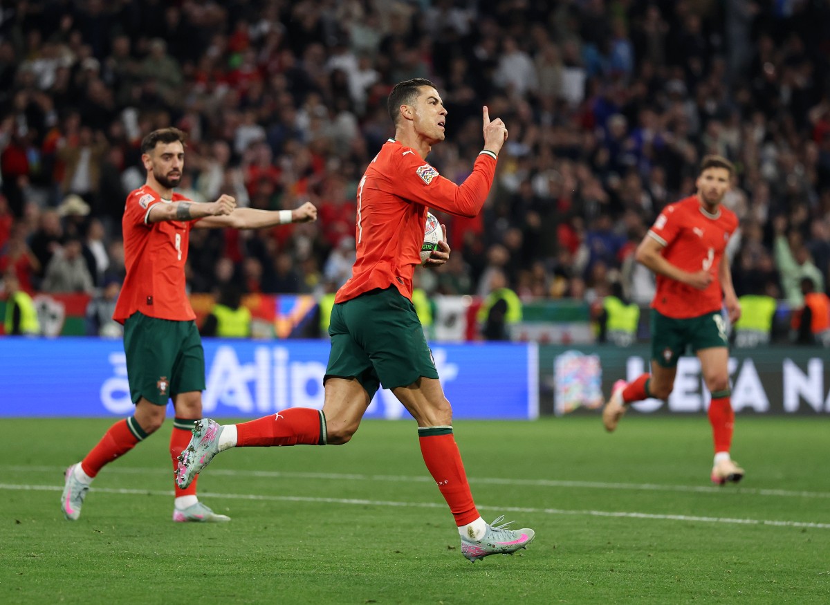 Cristiano Ronaldo celebrates scoring for Portugal against Spain