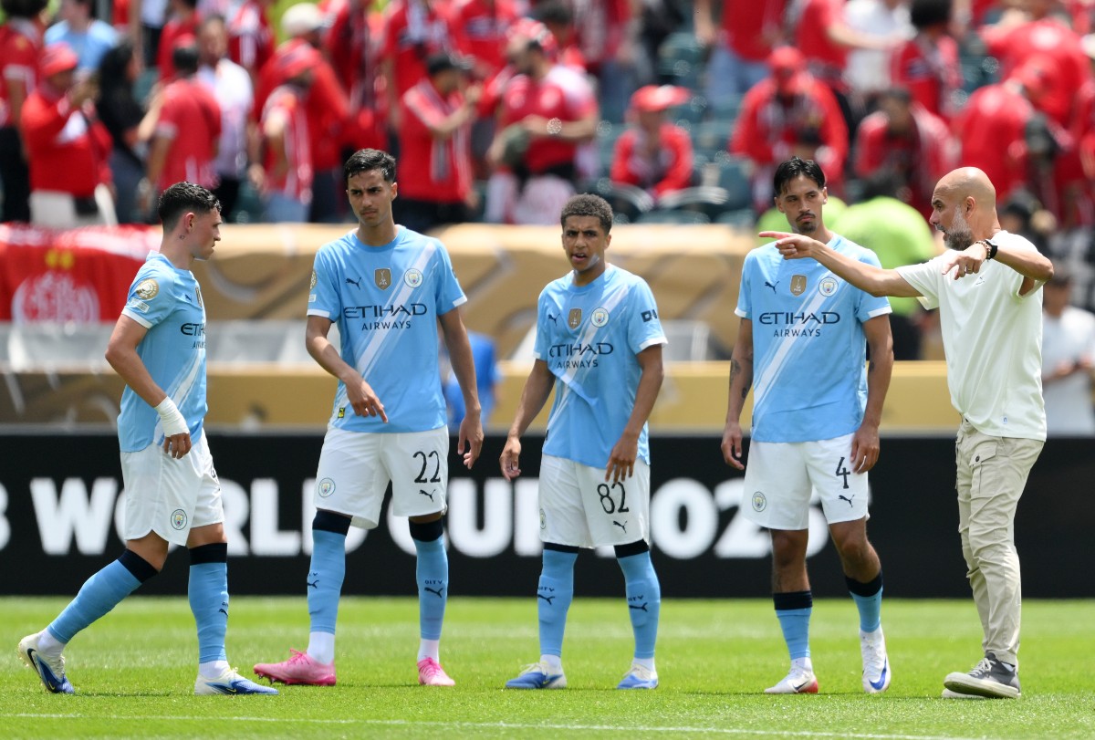 Pep Guardiola with Manchester City players at the club's World Cup