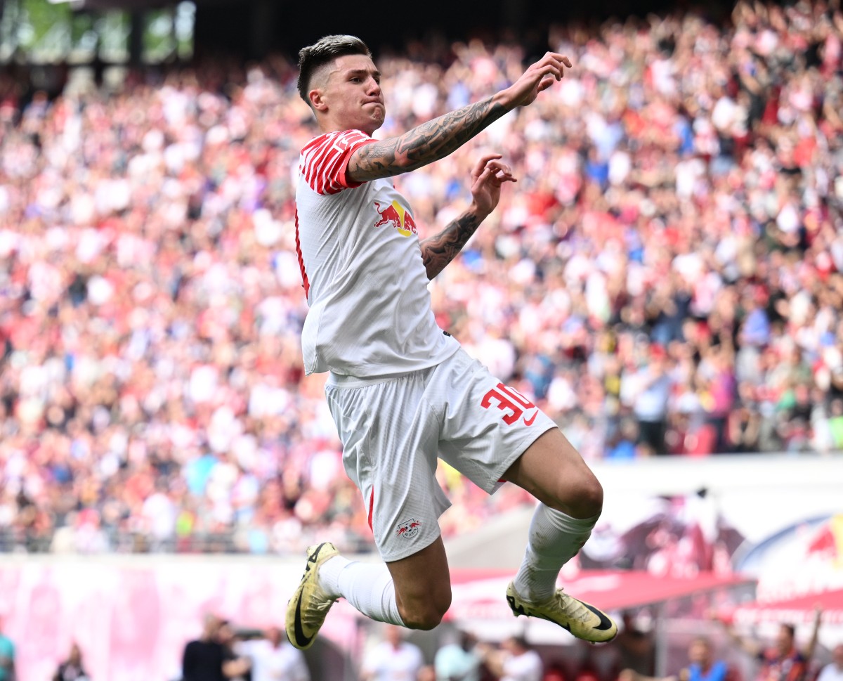 RB Leipzig striker Benjamin Sesko celebrates a goal against Wolfsburg