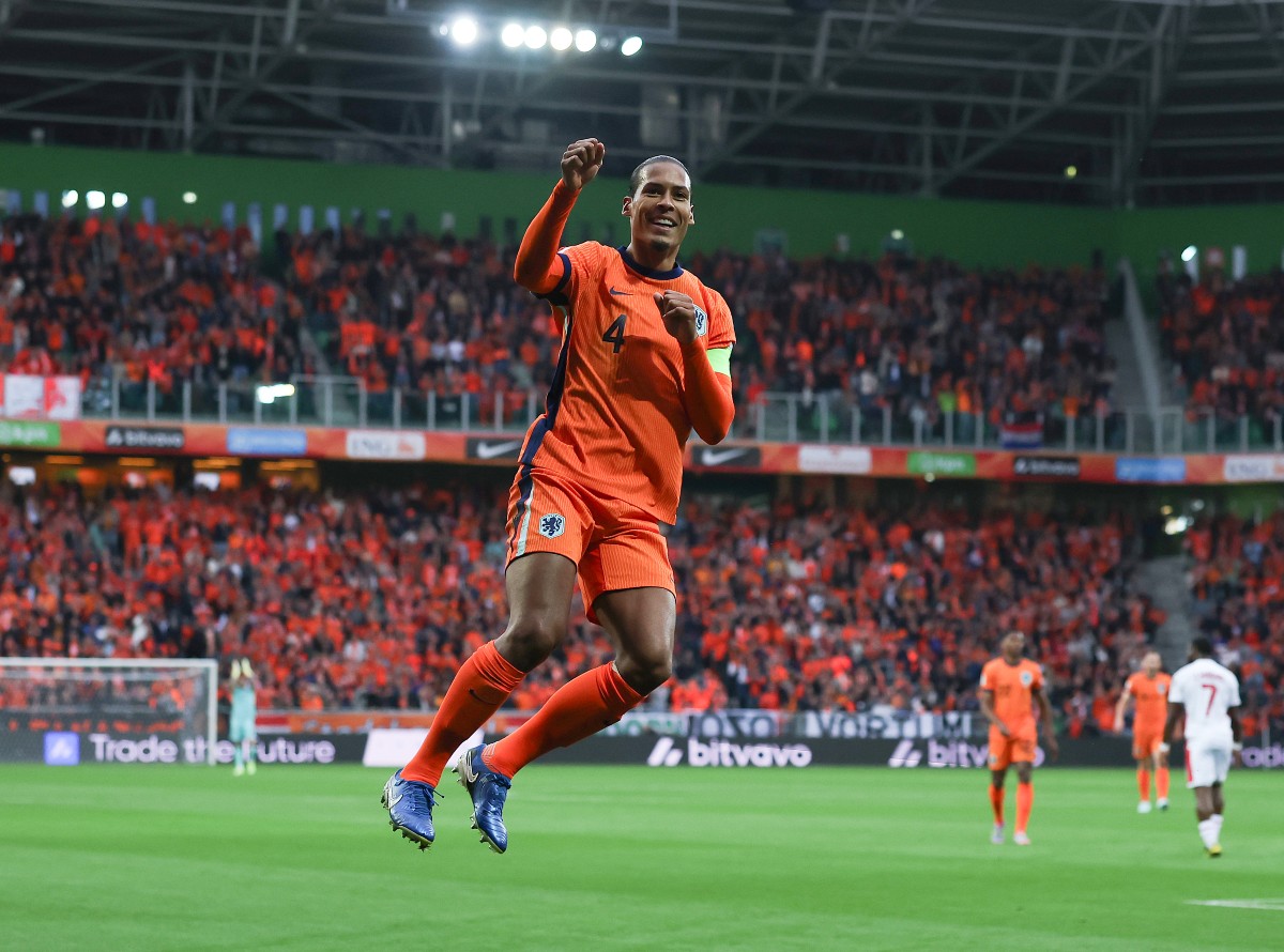 Virgil van Dijk celebrates scoring for the Netherlands against Malta