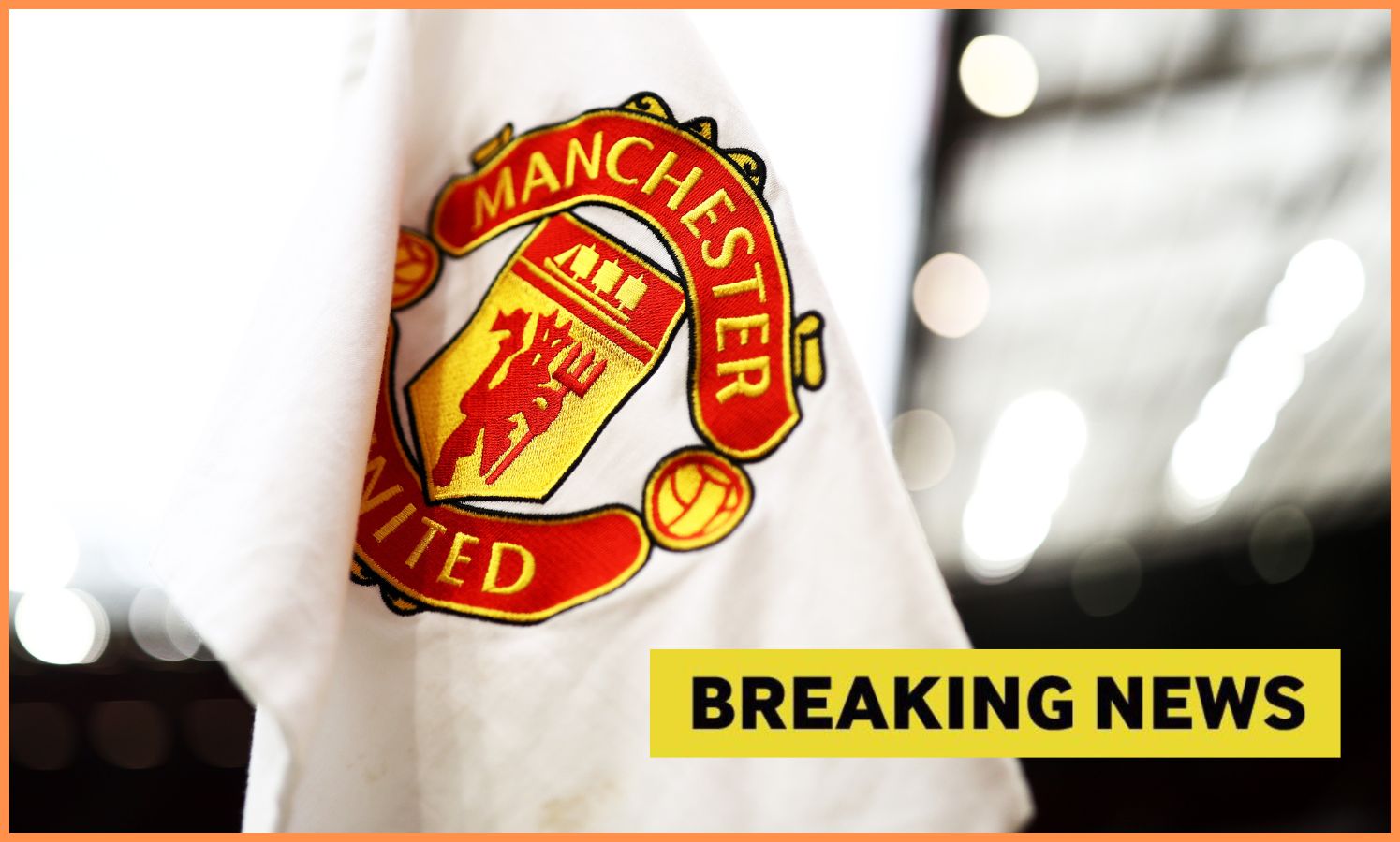 Manchester United corner flag, plus yellow 'breaking news' banner