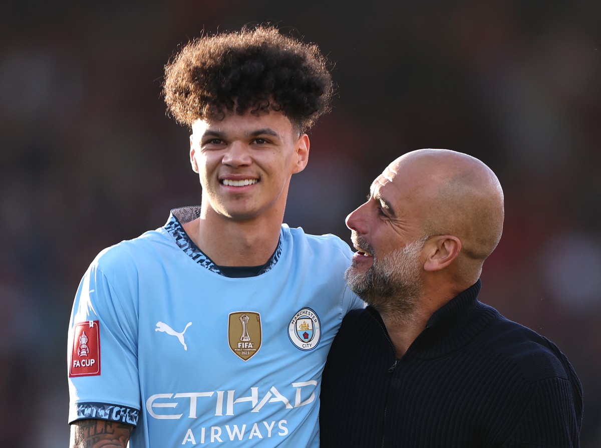 Nico O'Reilly celebrates with Pep Guardiola