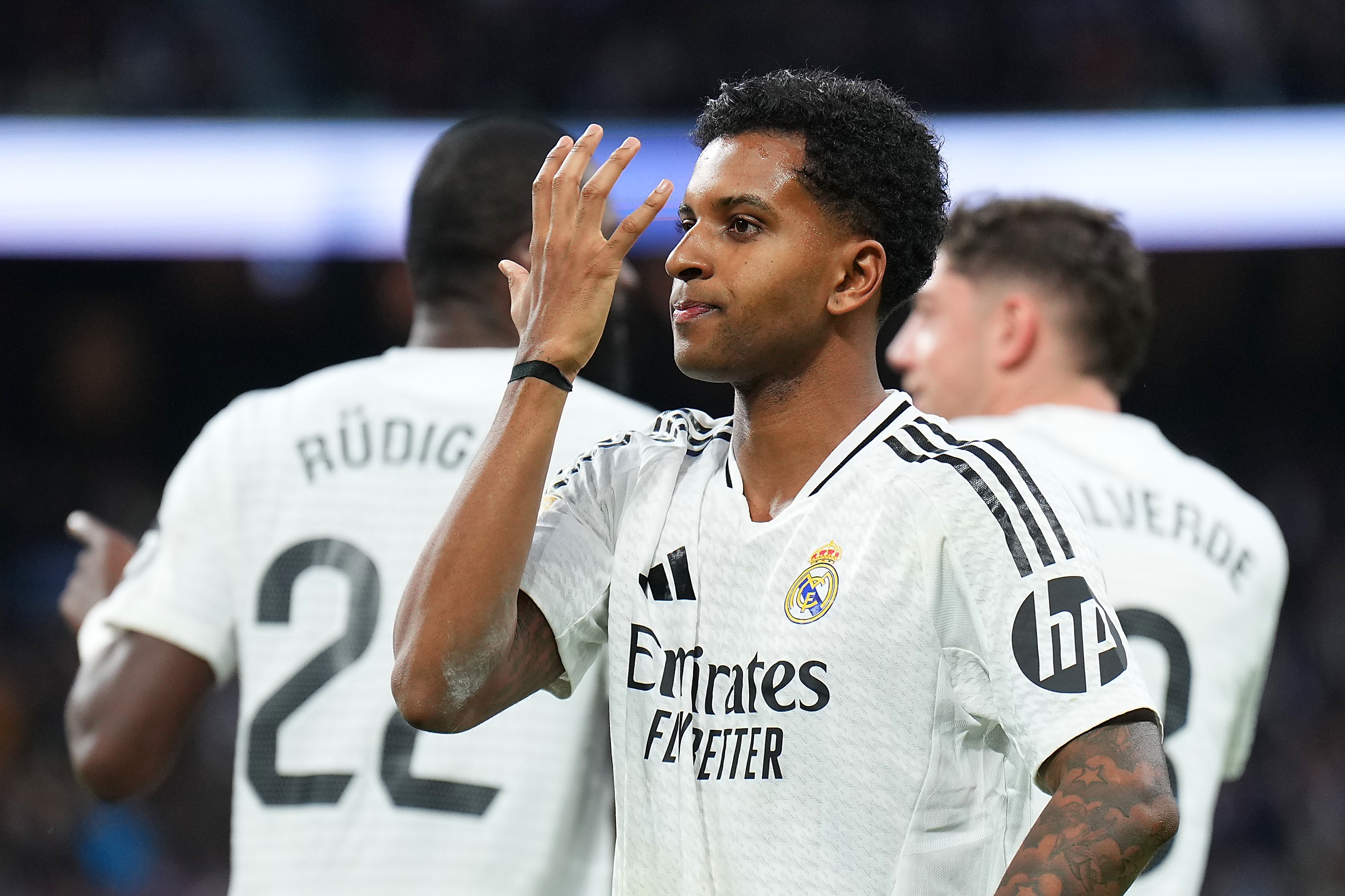 Rodrygo waves his hand in front of his face.