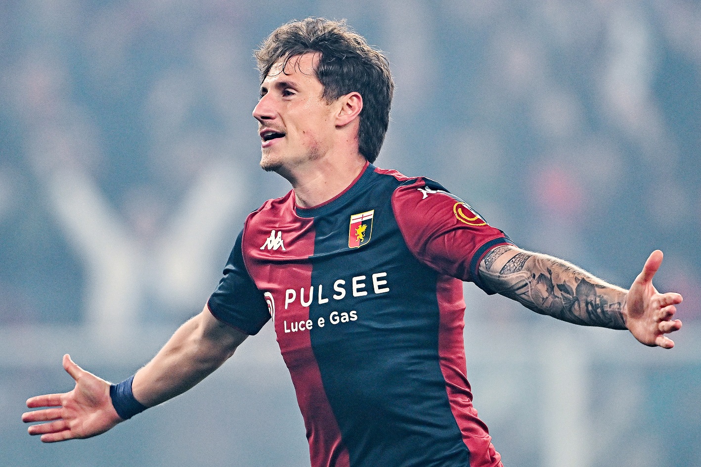 Andrea Pinamonti of Genoa celebrates after scoring