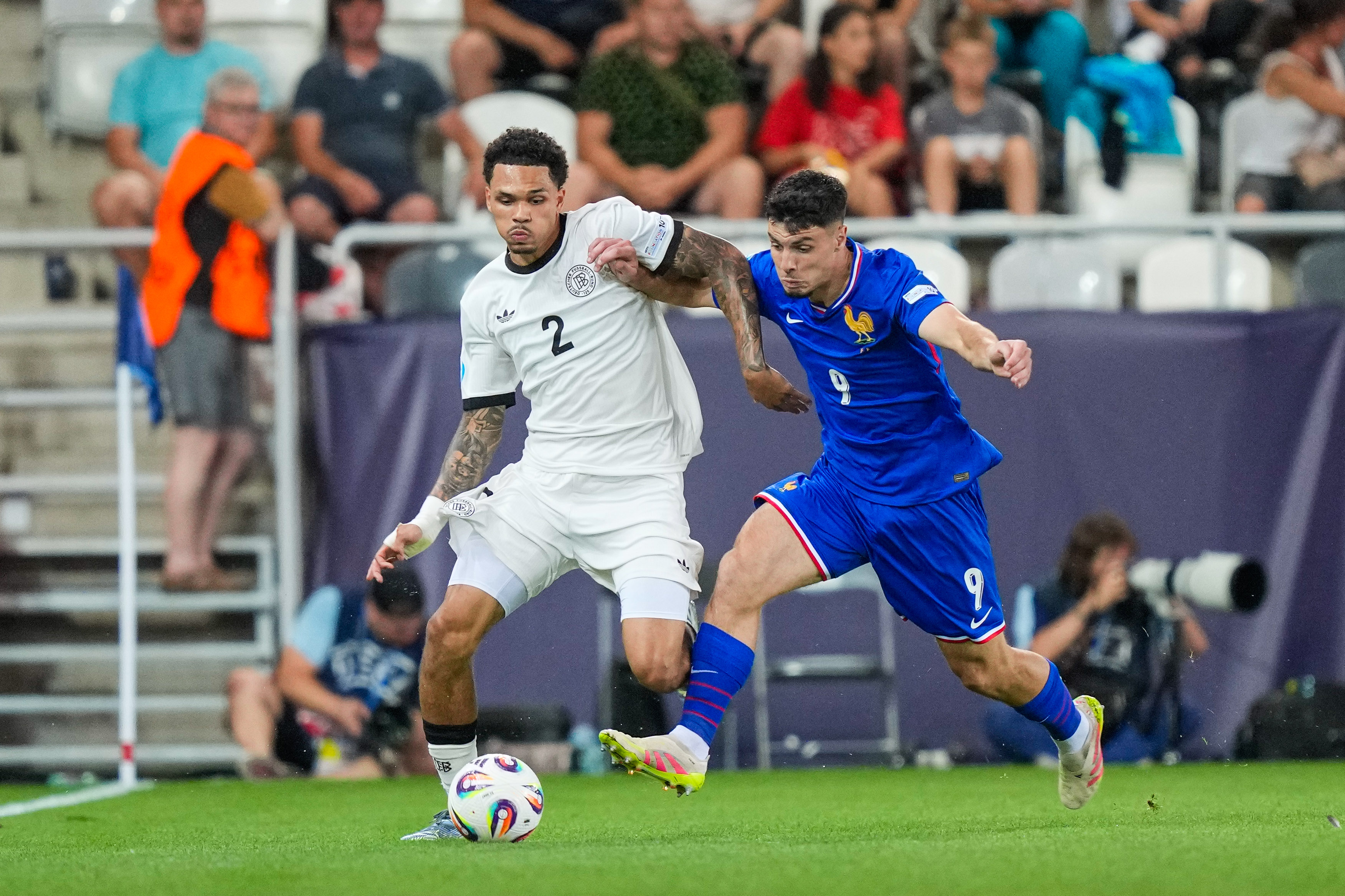 U21 Germany U21 Germany's NNNNAMDI Collins, U21 Matthis Abline runs under pressure