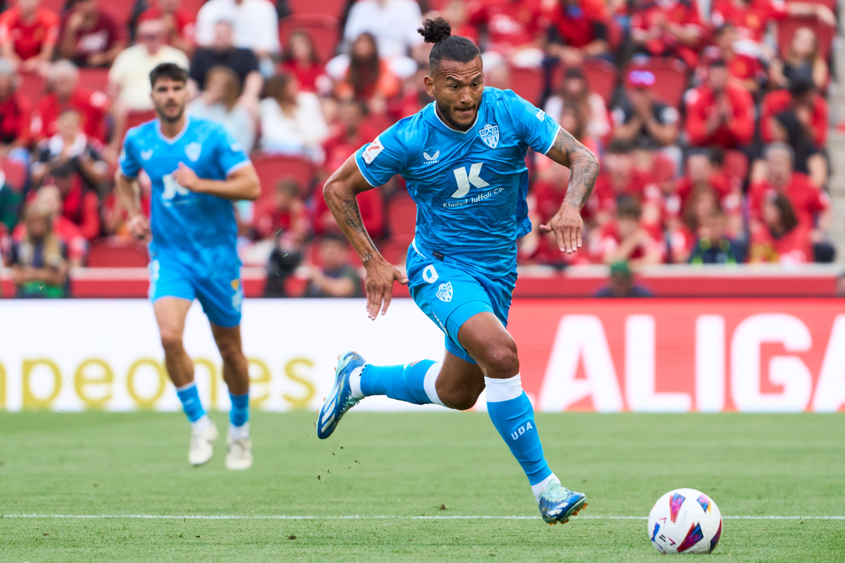 Ud Almeria's Luis Suarez is running with the ball