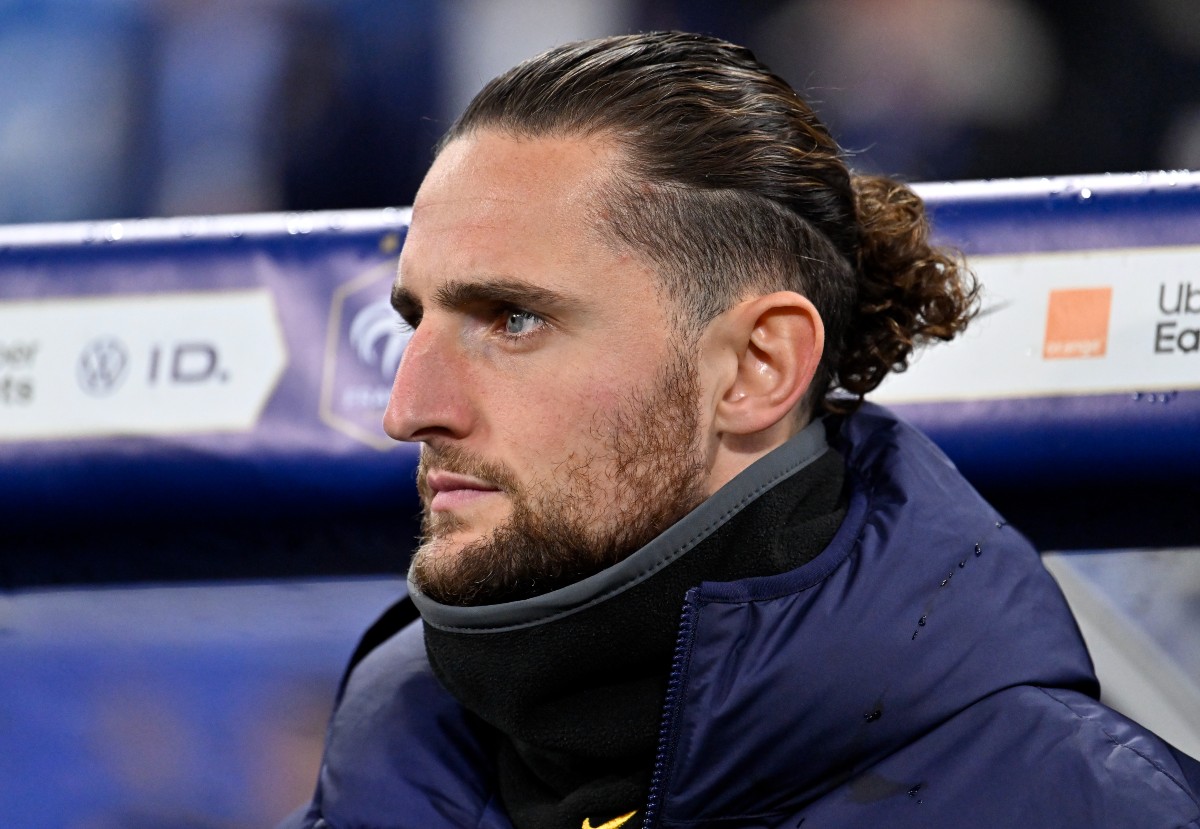 Adrien Rabiot looks on from the France bench