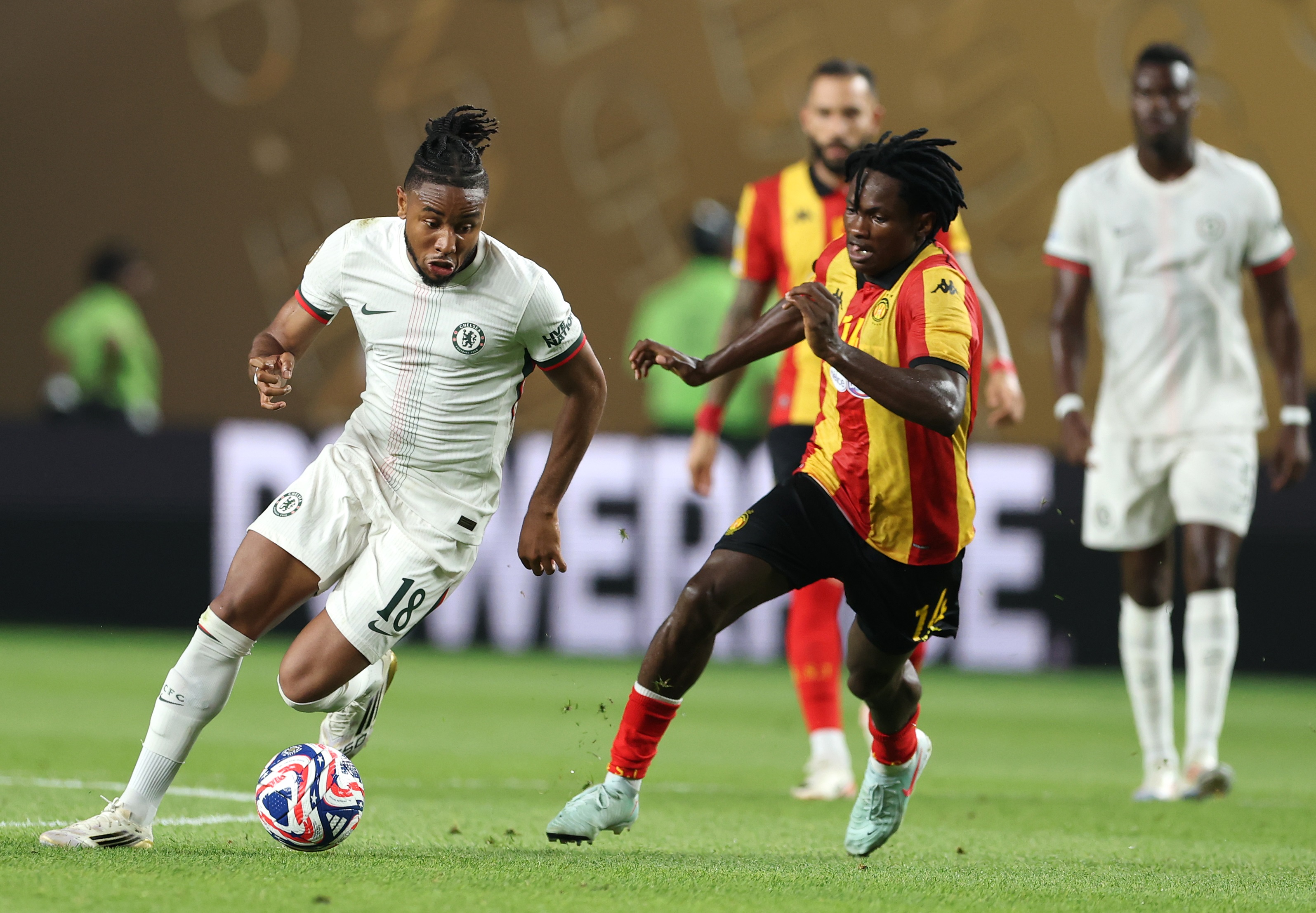 Christopher Nkunku dribbles with the ball whilst under pressure.