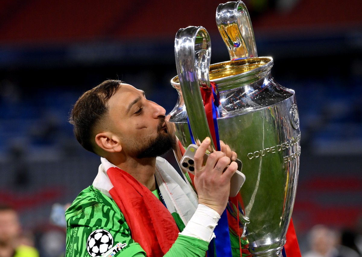 Gianluigi Donnarumma kisses the Champions League trophy