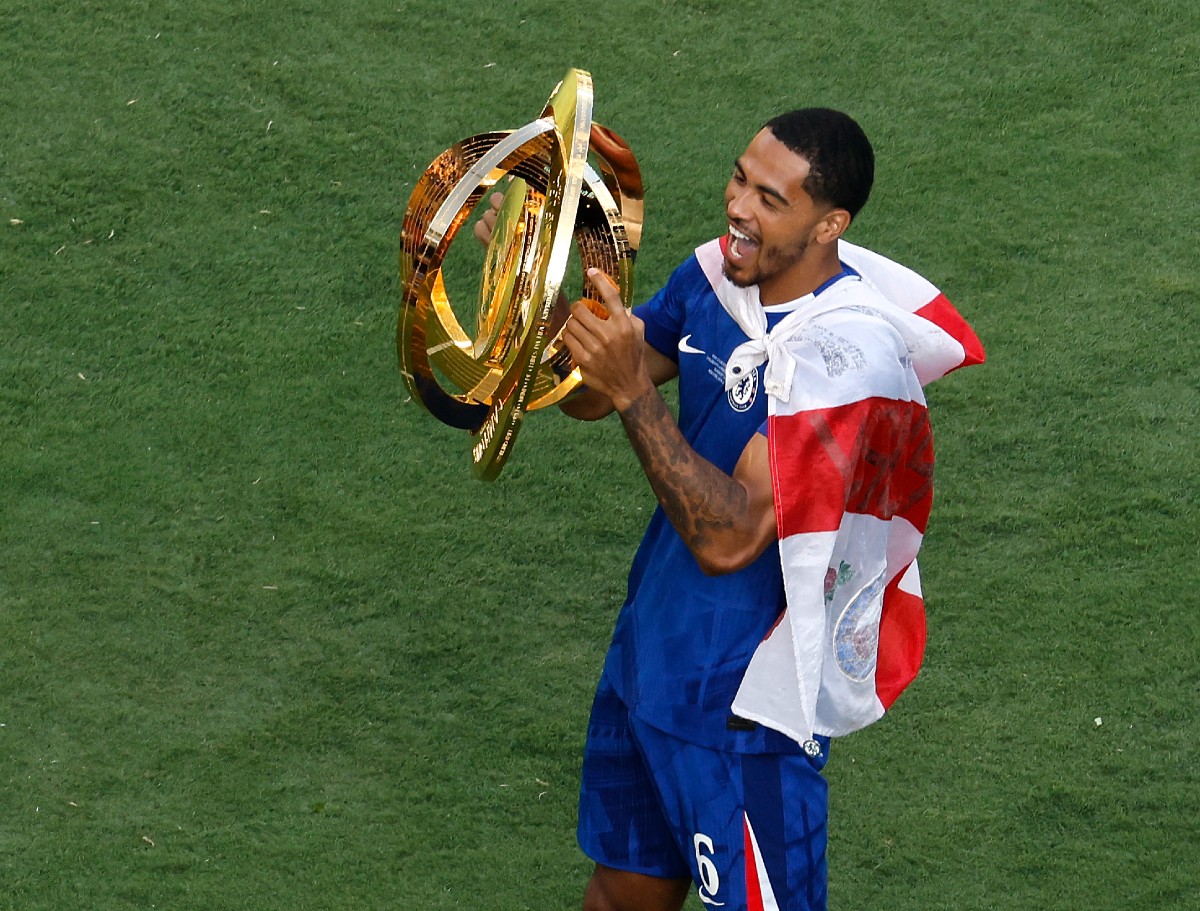 Levi Colwill celebrates with the Club World Cup trophy