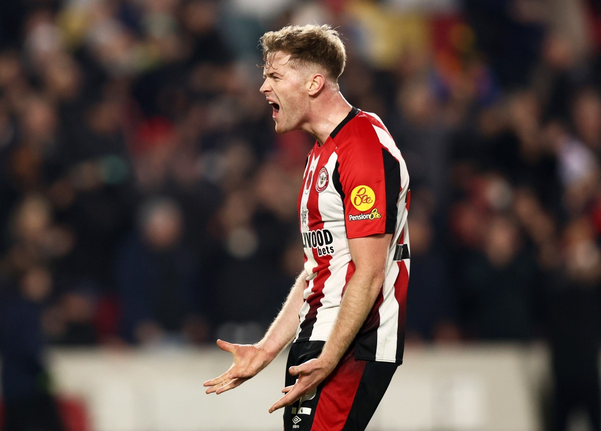 Nathan Collins celebrates Brentford's win over Bournemouth last season