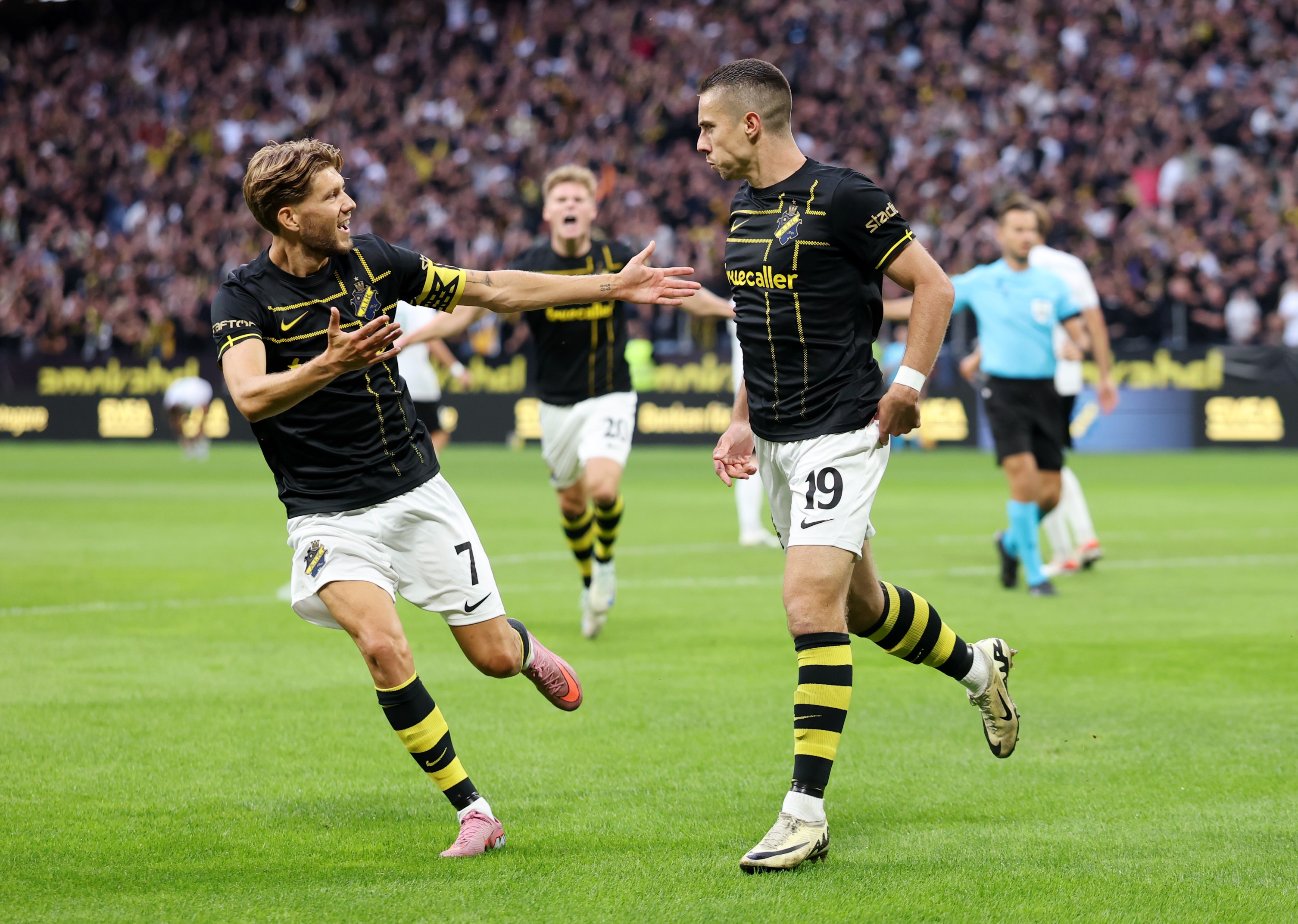 Dino Besirovic of AIK celebrates with teammate Anton Saletros after scoring