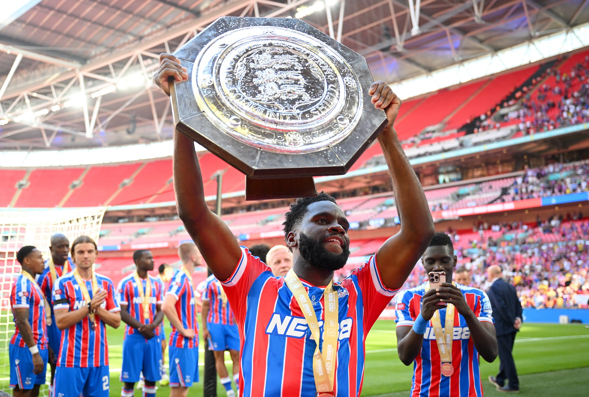 Odsonne Edouard of Crystal Palace holds the trophy  