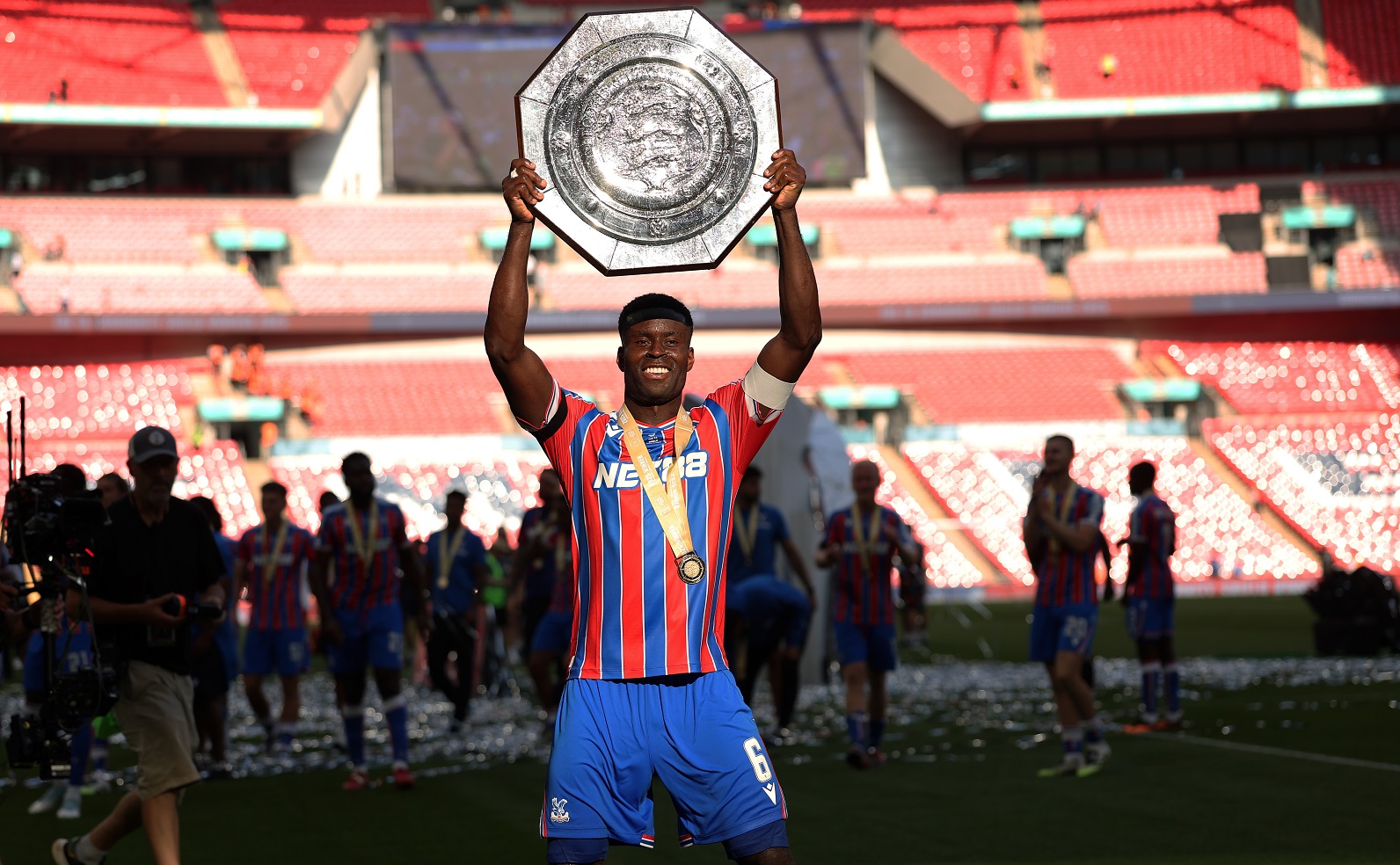 Mark Goy from Crystal Palace bears the charitable shield