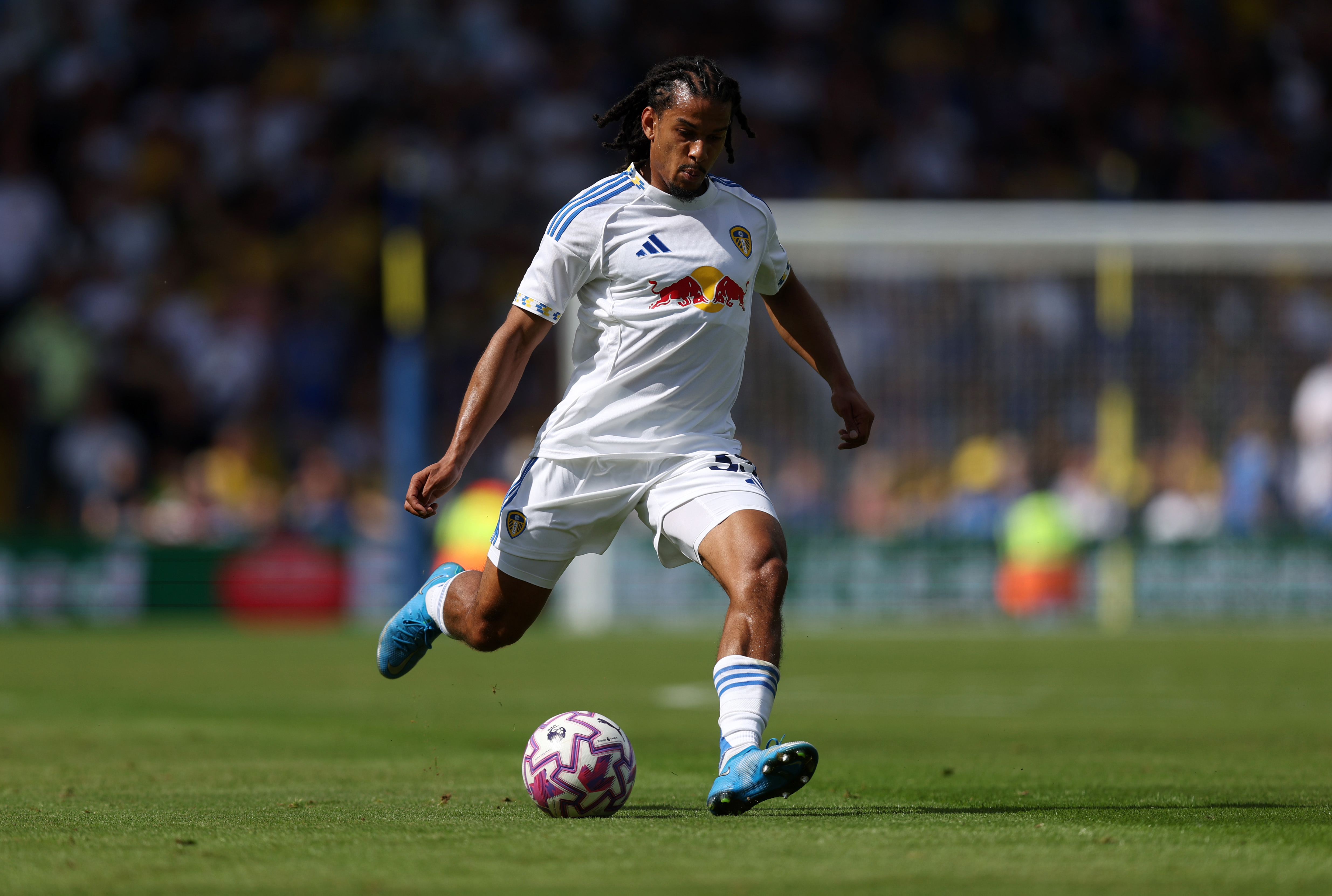 Isaac Schmidt from Leeds United passes the ball
