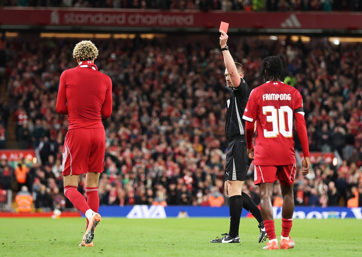 Hugo Ekitike receives a red card to remove the shirt