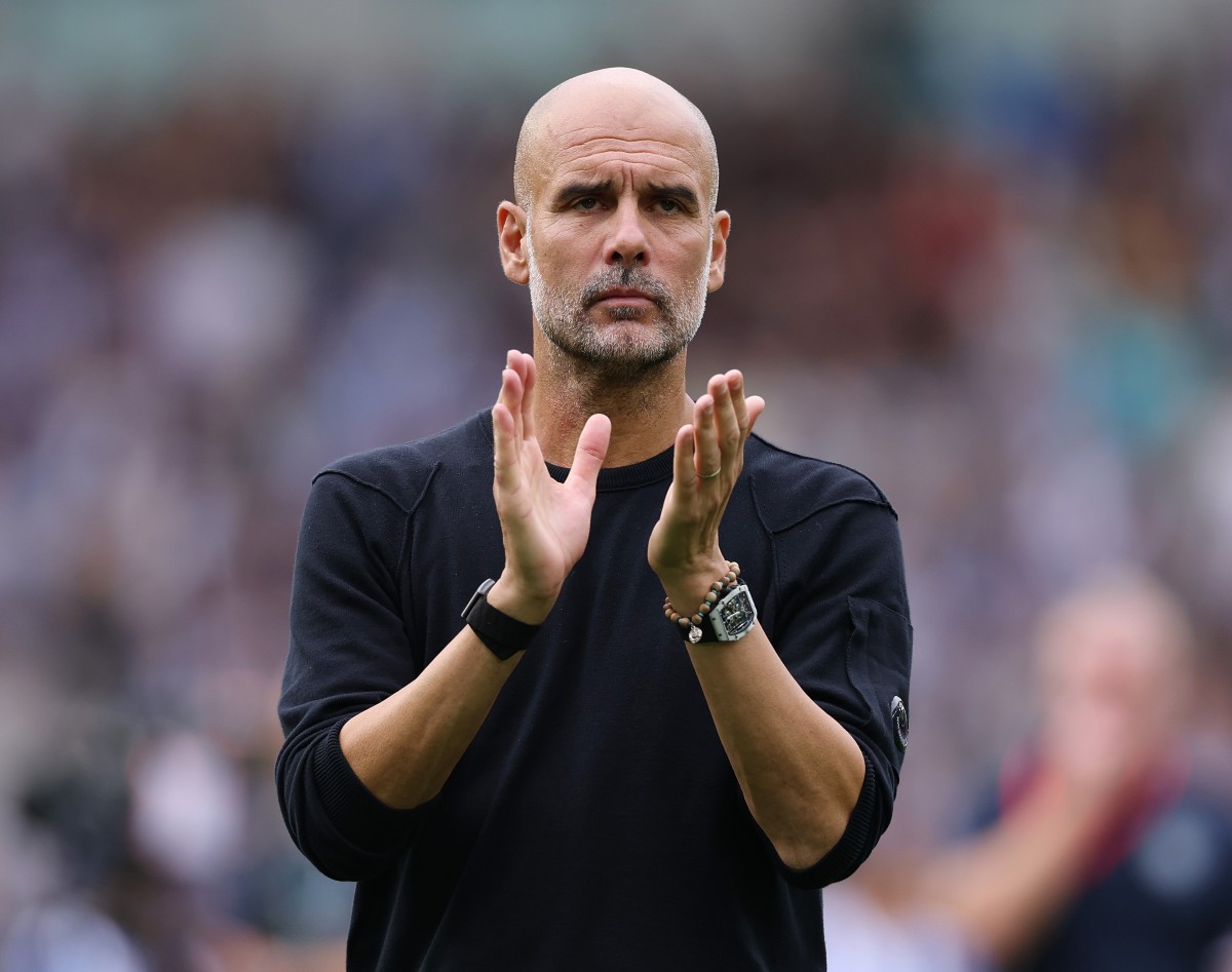 Pep Guardiola applauds the Manchester City fans