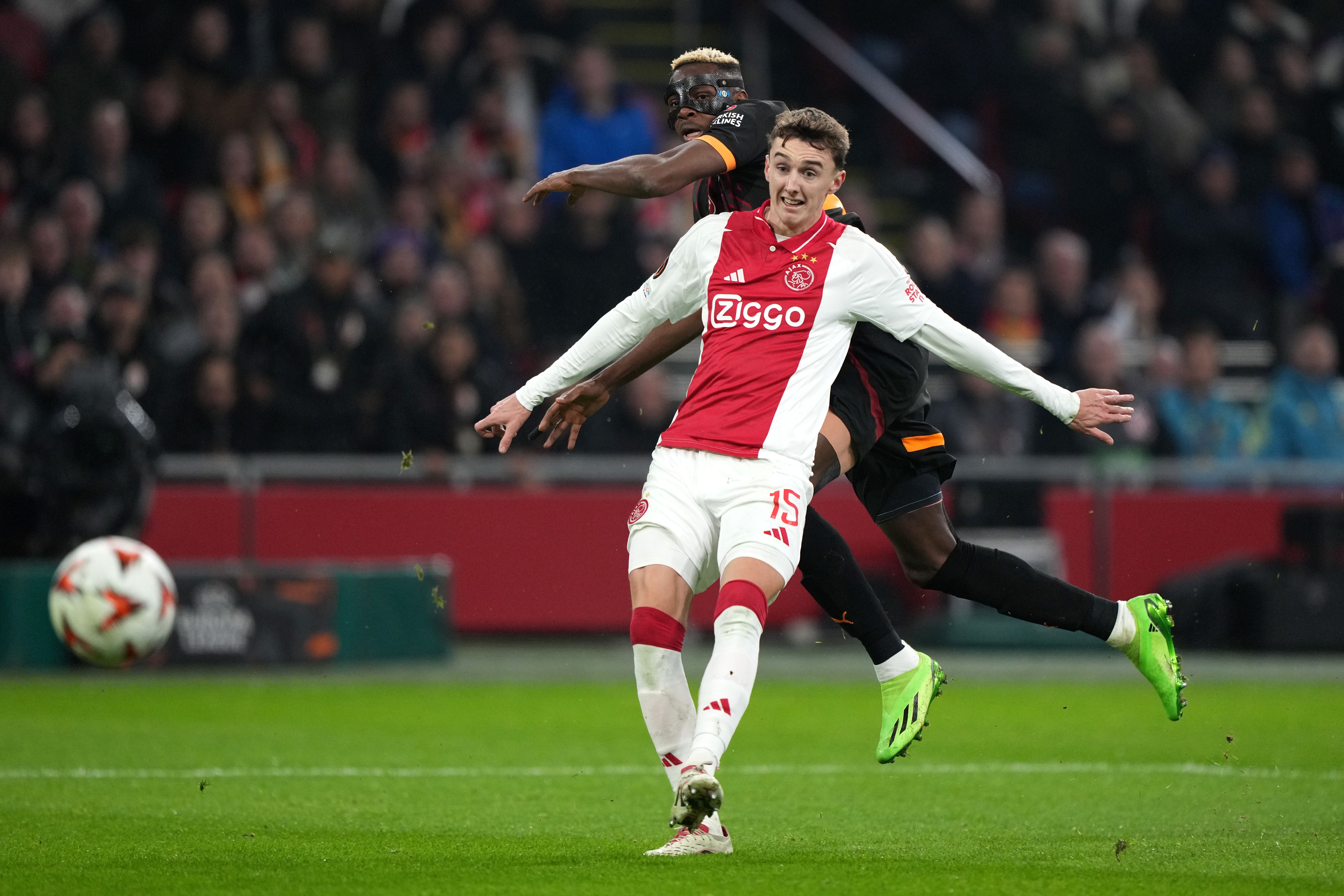 Victor Osimhen #45 Galatasaray takes a shot at goal as Youri Baas #15 of Ajax defends
