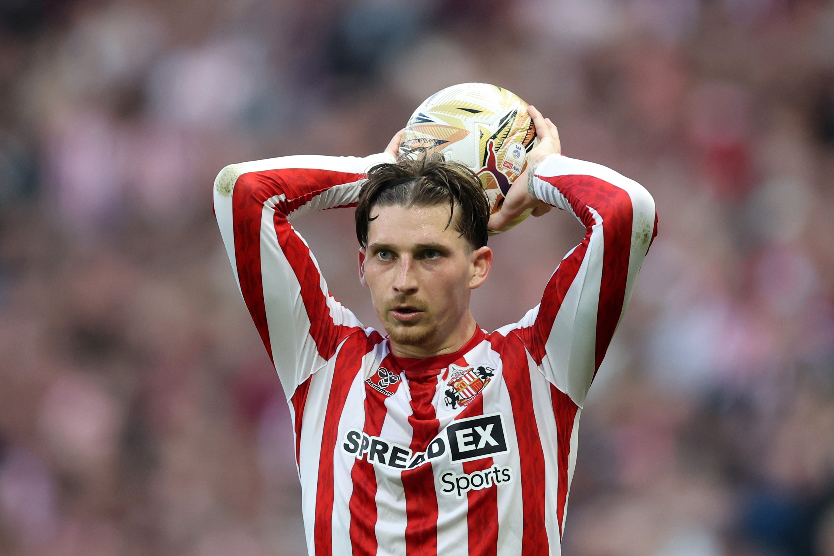Dennis Cirkin of Sunderland takes a throw in