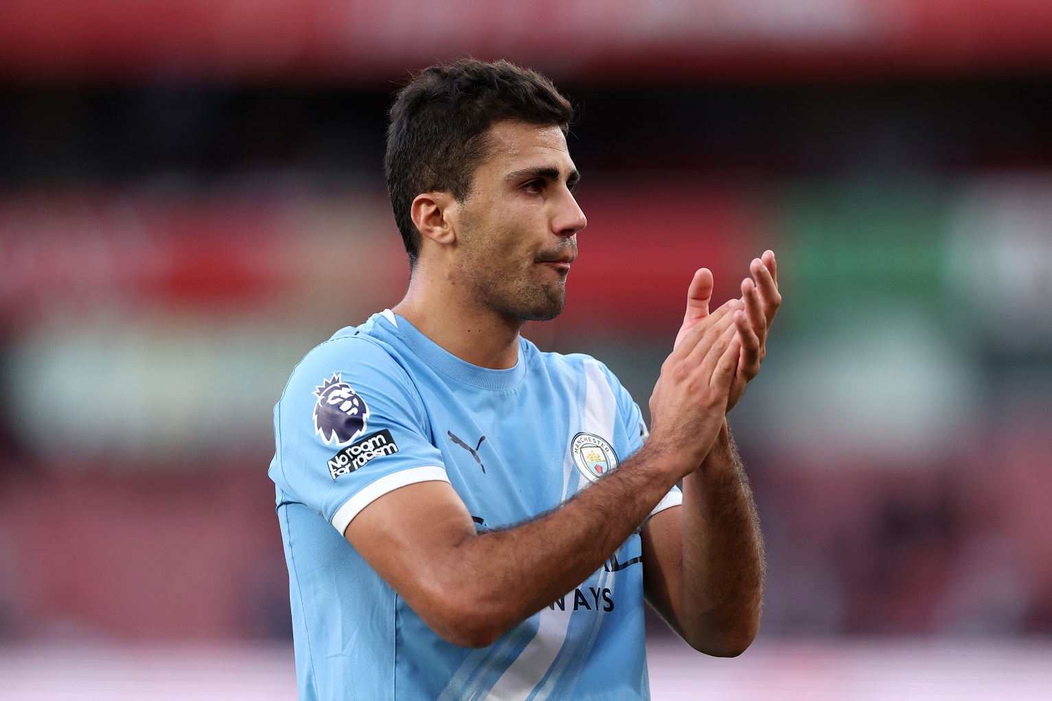 Rodri of Man City claps the fans