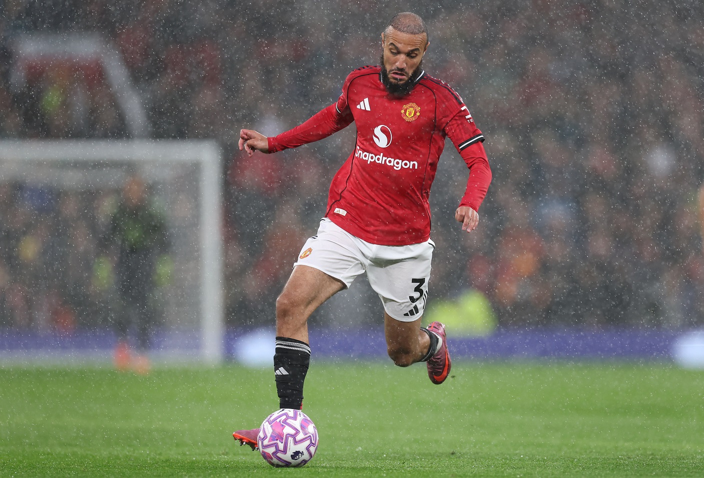 Noussair Mazraoui of Manchester United runs with the ball