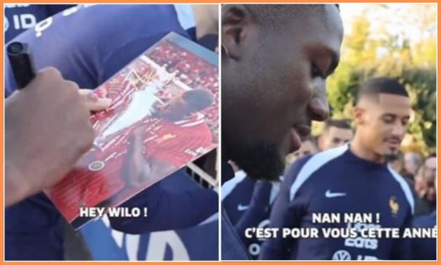 Ibrahima Konate signing an autograph