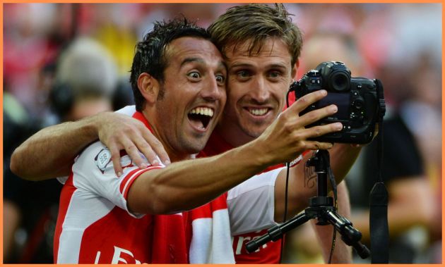 Santi Cazorla celebrates with Nacho Monreal