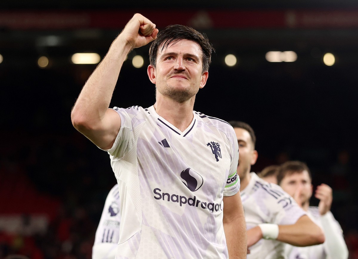 Harry Maguire celebrates Manchester United's away win against Liverpool