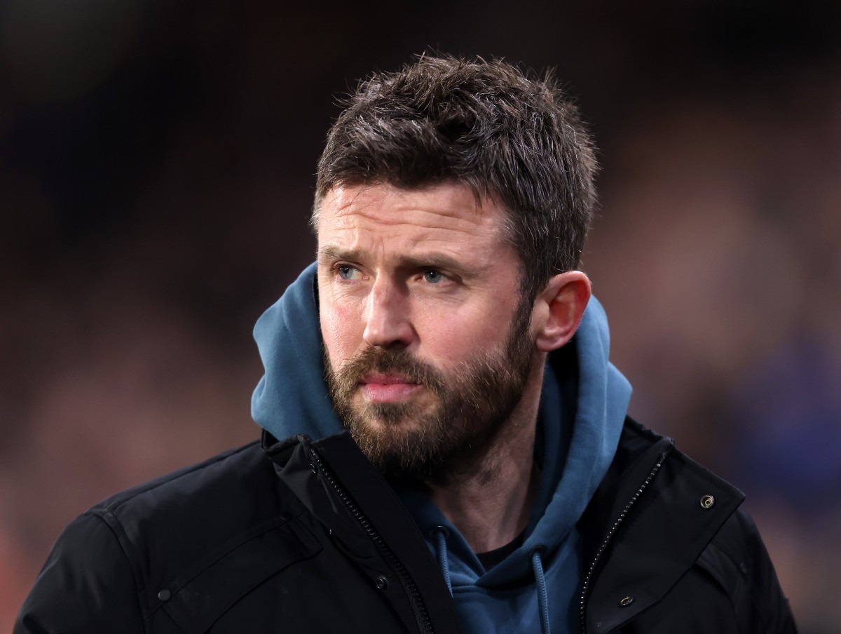 Michael Carrick looks on