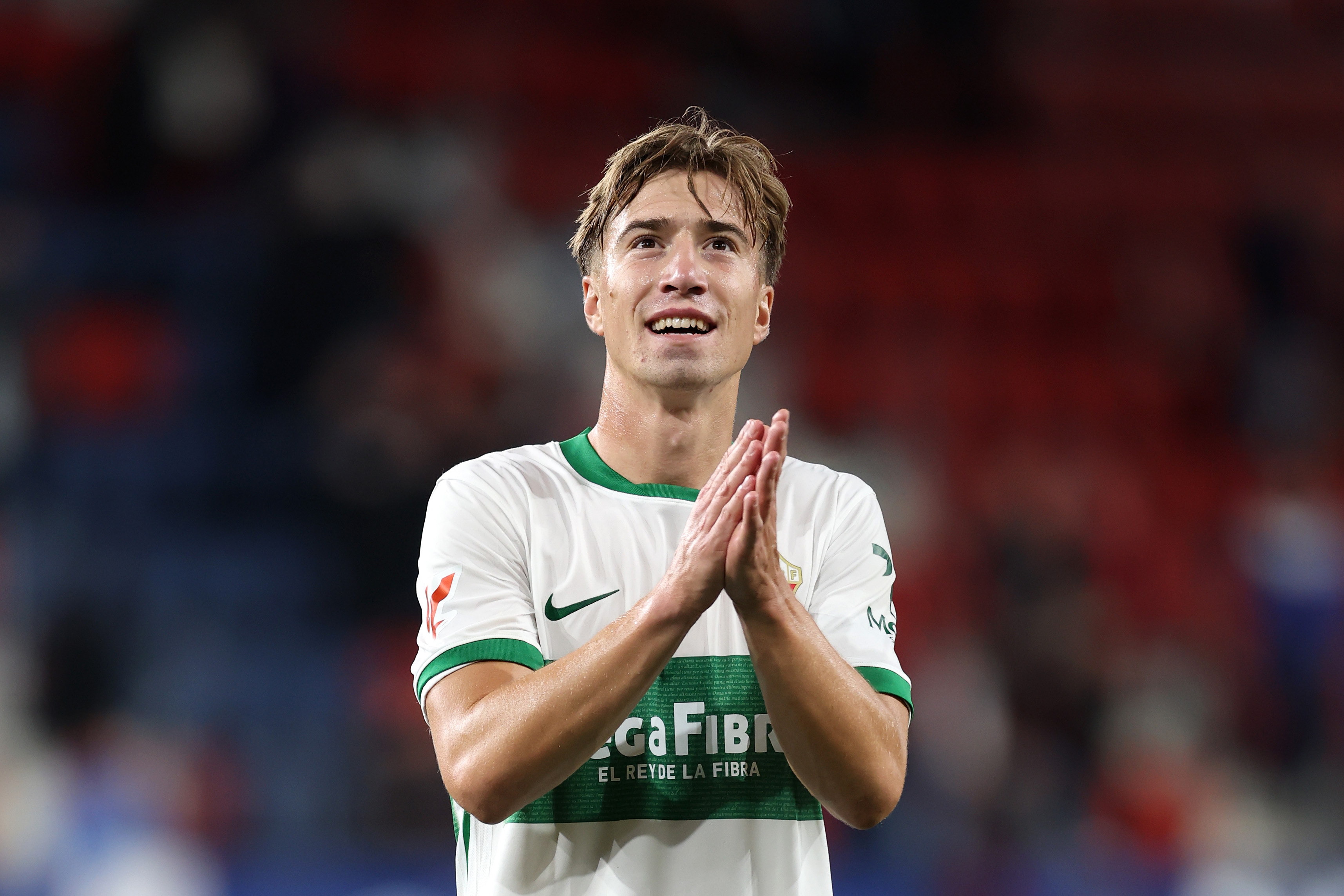 David Affengruber of Elche CF applauds the fans following a LaLiga match