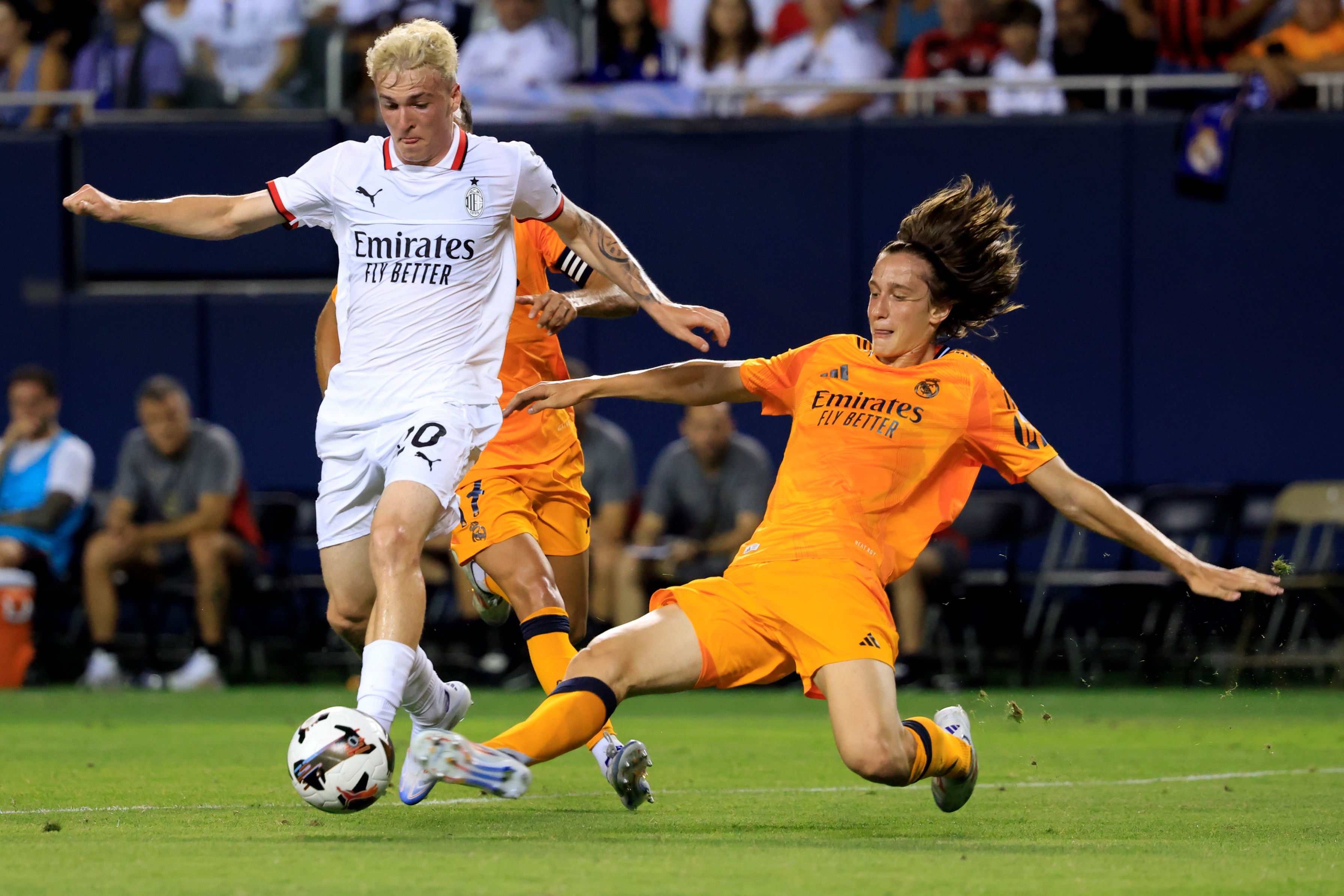 Alejandro Jimenez of AC Milan is challenged by Joan Martinez Lozano of Real Madrid during a Pre-Season Friendly