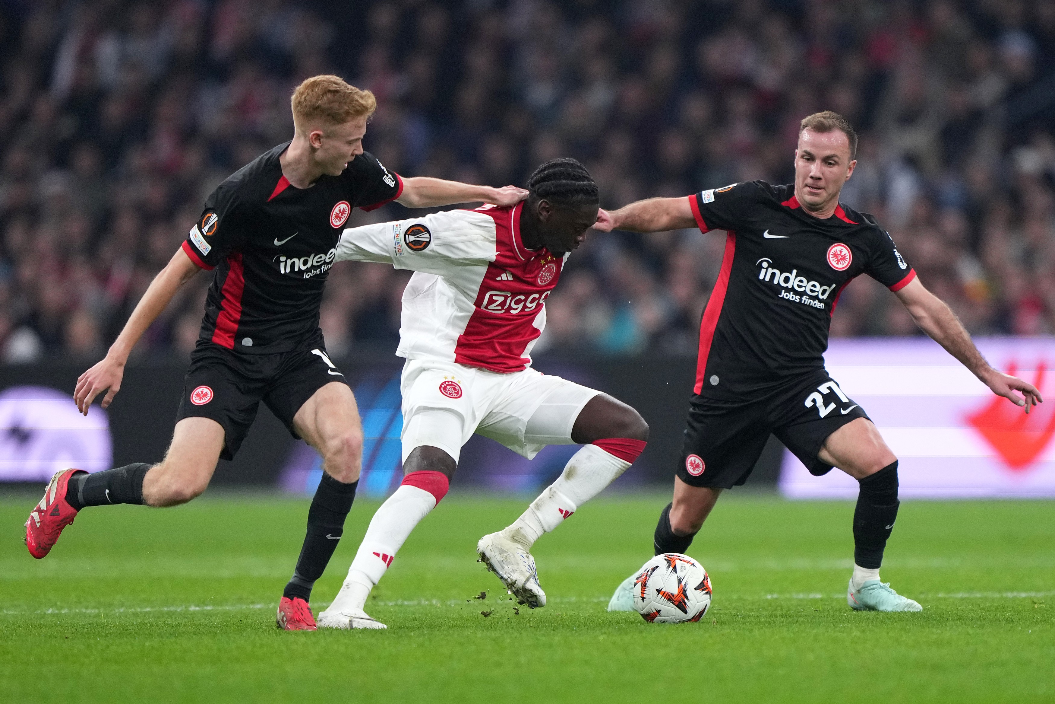 Jorthy Mokio #31 of Ajax dribbles the ball