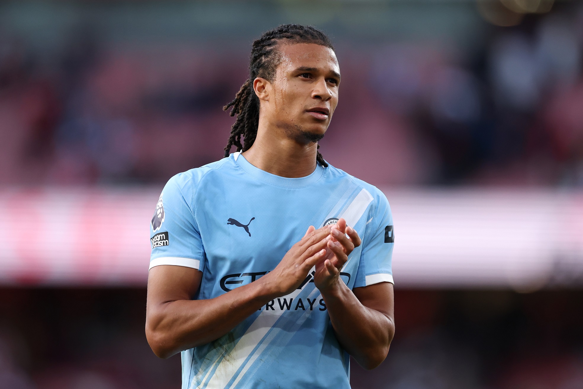 Nathan Ake of Manchester City claps the fans
