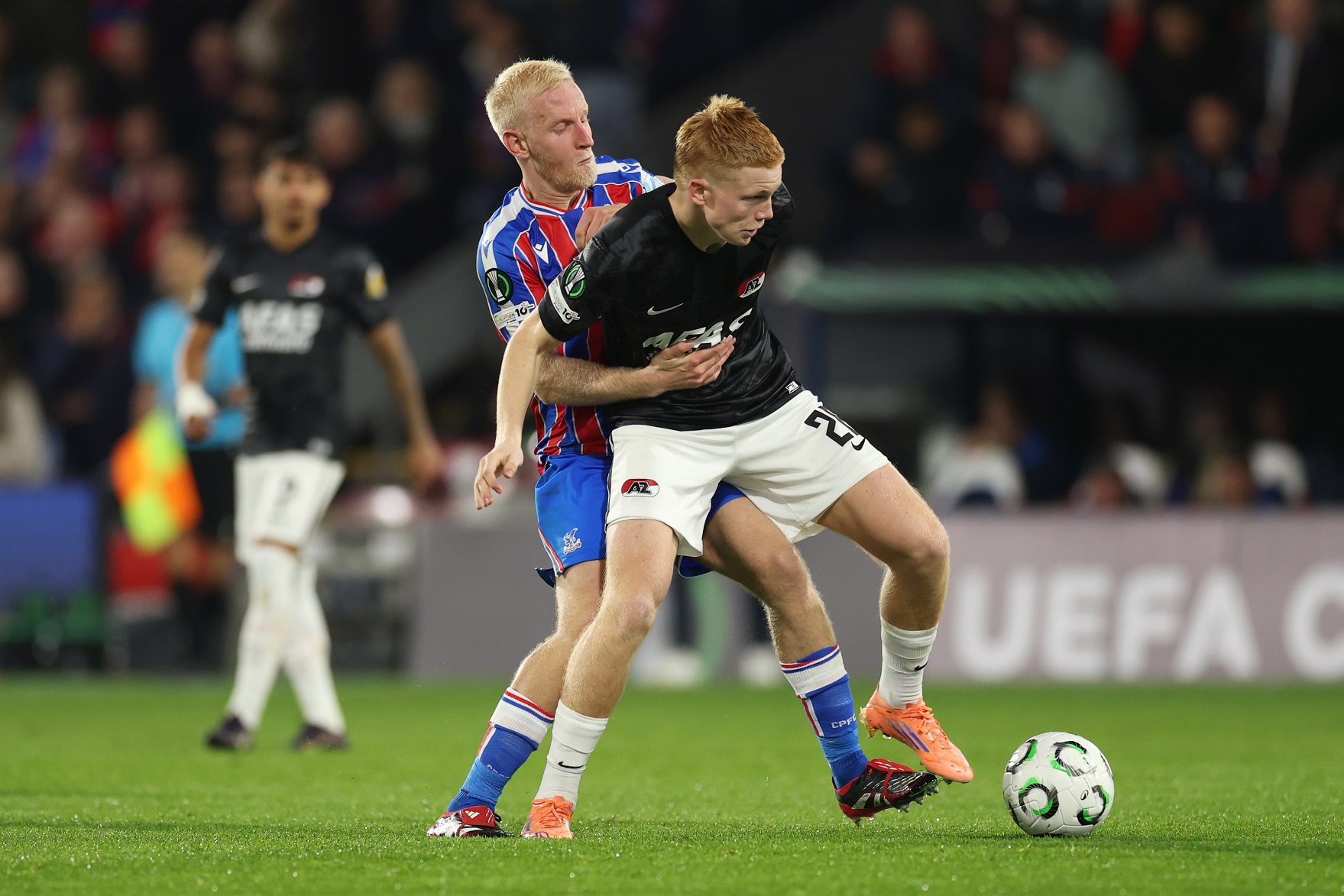 Kees Smit of AZ Alkmaar  is challenged by Will Hughes of Crystal Palace