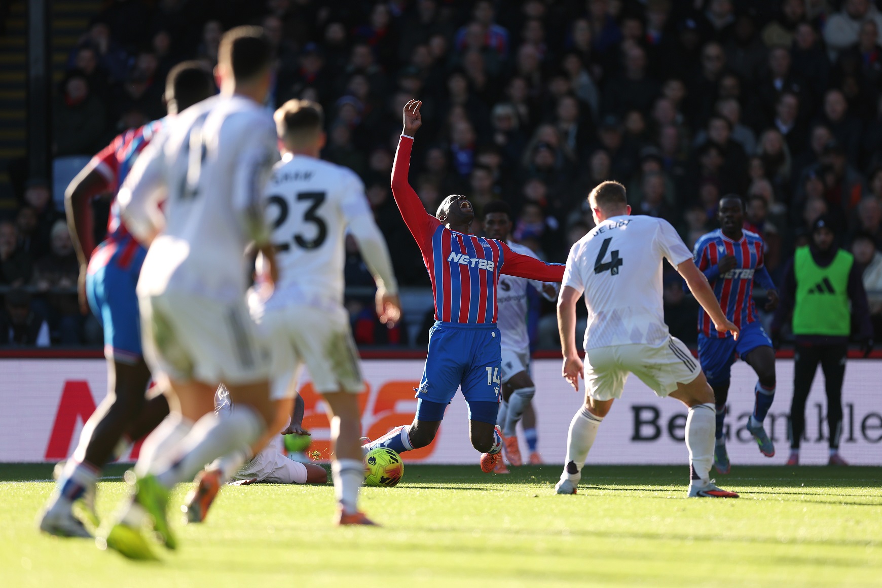 Jean-Philippe Mateta of Crystal Palace is fouled by Leny Yoro of Manchester United