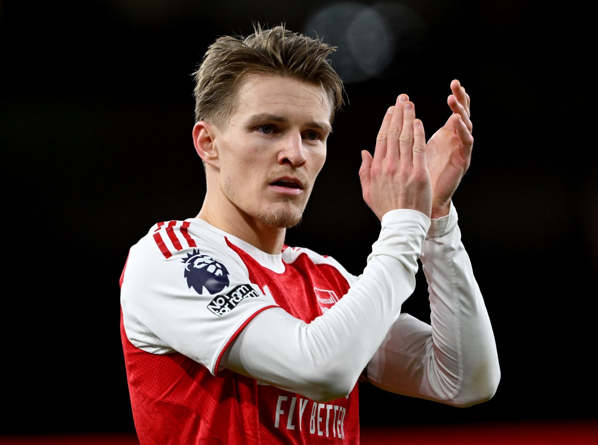 Martin Odegaard applauds the Arsenal fans