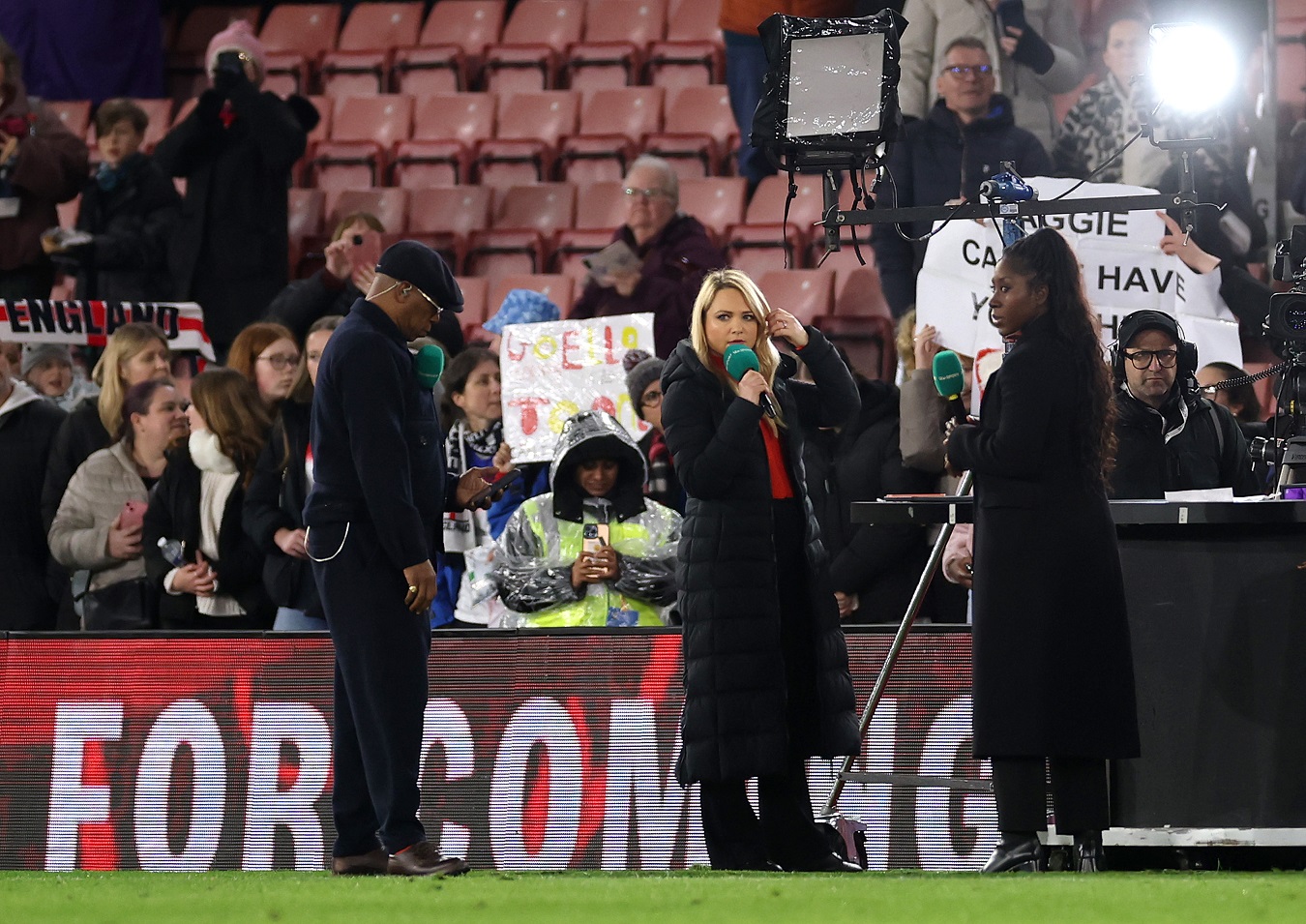 Presenters Ian Wright, Katie Shanahan, Anita Asante look on after presenter Laura Woods (not pictured) collapsed earlier