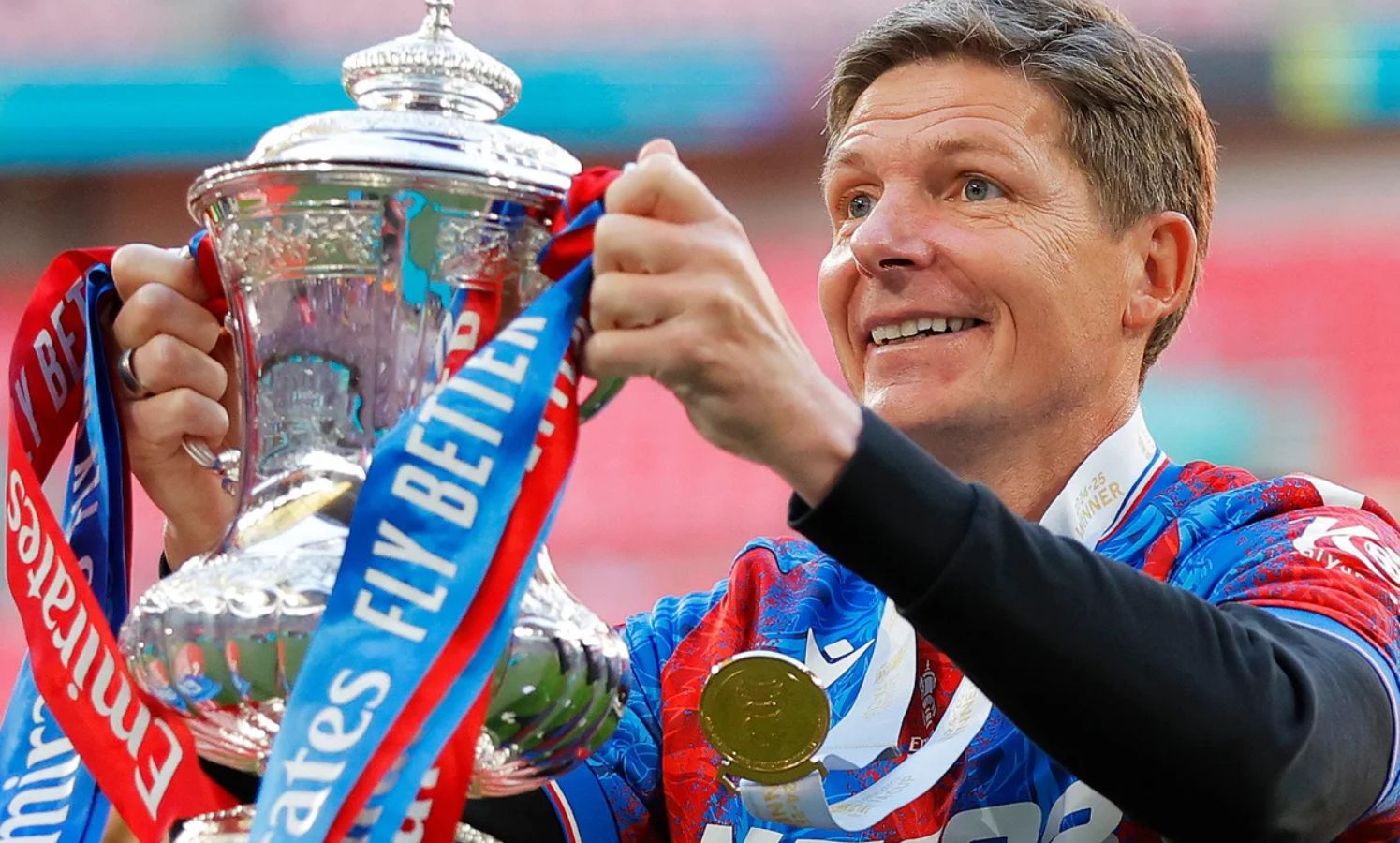 Oliver Glasner celebrates with the FA Cup trophy last season